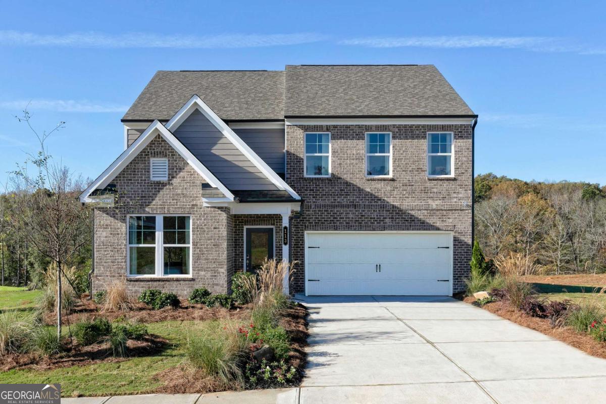 Welcome to Kinglsey at Lake Allatoona, the new Stanley Martin Community in Acworth, GA! LOT 27. Ask about the AMAZING builder Incentives available - UP TO 3% In the Idlewild floorplan, you can mix and mingle with friends and family in your open-concept first floor, which includes a kitchen overlooking the family room and dining area. A bedroom at the front of the home can be used for guests to have their own private space. The covered rear patio provides the perfect spot to relax and enjoy your new home. Upstairs, the owner's suite boasts a large walk-in closet off the en suite bathroom with double vanities, walk-in shower and separate soaking tub. Additional bedrooms provide the perfect place for family or friends to rest their heads at night. Plus, take the chore out of doing the laundry with a conveniently located laundry room on the upper level! A full bathroom and an additional flex space as a play space, home office or crafting nook, to name a few - it's truly what you make of it! Some of the SMart Selected design options in this home include a gourmet kitchen & center island, large owner's suite with walk-in closet and en suite bath, patio, main level guest suite with full bath, and upper-level flex space.