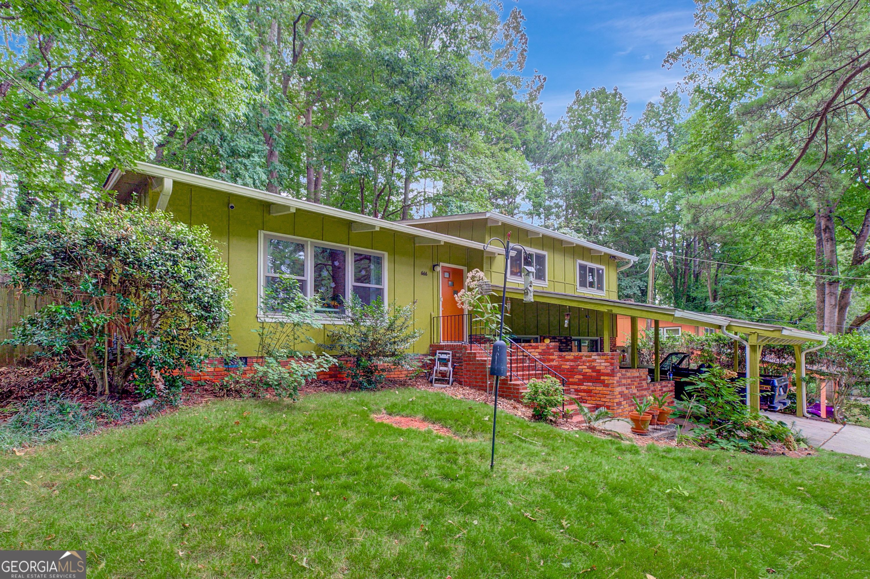 A midcentury modern masterpiece in Decatur that will simply stun you! From stained timbered ceilings to its time-capsule-esque midcentury vibe in every single room to a brick fireplace in the lower den level . .. this home frankly has everything you are looking for. The expansive living area on the main floor features a light filled living room with vaulted ceilings and original hardwood floors that naturally flow into the vibey kitchen and dining room. Continue to invite nature in with a screened porch and a fenced private backyard off the dining area. Entertainers will find this home dreamy, as a few steps downstairs will lead you to another den with built in wood shelving, a massive brick wall fireplace, a full bathroom, and a multifunctional laundry/utility room. A few steps upstairs in this split level floor plan offers three bedrooms, all with vaulted timbered ceilings throughout and hardwood floors, a full bathroom in the hall, and an ensuite half bathroom in one of the bedrooms. Enjoy all of the MCM aesthetic without all of the worry, as the owner occupant has completed almost every renovation you can think of including double paned windows, a roof, kitchen and bathroom renovations/updates, and more. Don't let this midcentury stunner pass you by, especially in a Decatur neighborhood with voluntary membership to the community pool.