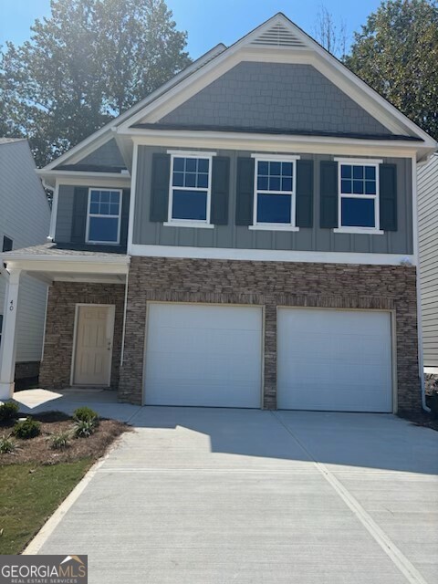 This is a beautiful 4 Bedroom, 2.5 Bath, 2 Story home with front entry Double Garage. The exterior has stone accents on the front of the home, and stone water table down each side with a back patio for outdoor living. First story of this home has a 2 story foyer 1/2 bath and open concept. The Kitchen has a Large Island, Granite, LED Lighting, 36" Umber stained Cabinets, Vinyl Plank flooring and SS Gas Range, Dishwasher, and Venthood. Upstairs has plenty of natural light throughout the hallway. There is a Laundry Room, 3 Secondary Bedrooms, and shared Bath. The large Master Suite features Trey Ceiling with Large Walk-in-Closet. Master Bath with 42" Shower, Garden Tub, raised height double bowl Cultured Marble sinks. Do not miss out on the last 10 homes in the community. One of the best features of this community is the location. It is right by SR 440, the Outlet Mall and many Restaurants.