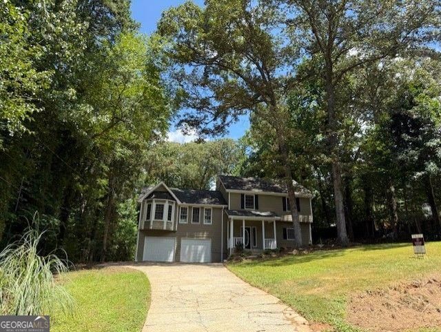 Welcome to the perfect opportunity for first time homeowner or if you are wanting to downsize. You will love this private wooded lot (.6309 ac.) and no HOA subdivision, plus minutes to lake Allatoona...Bring your boat! This spacious home has 3brs., 2.5 baths, Great Room with fireplace, dining room, eat in kitchen, the lower level has an extra large bonus room, huge laundry room/ toliet & sink, ajoined by oversized storage room with built-in shelves. Minutes from shopping, dining, boat storage & RV storage. Quick closing possible!