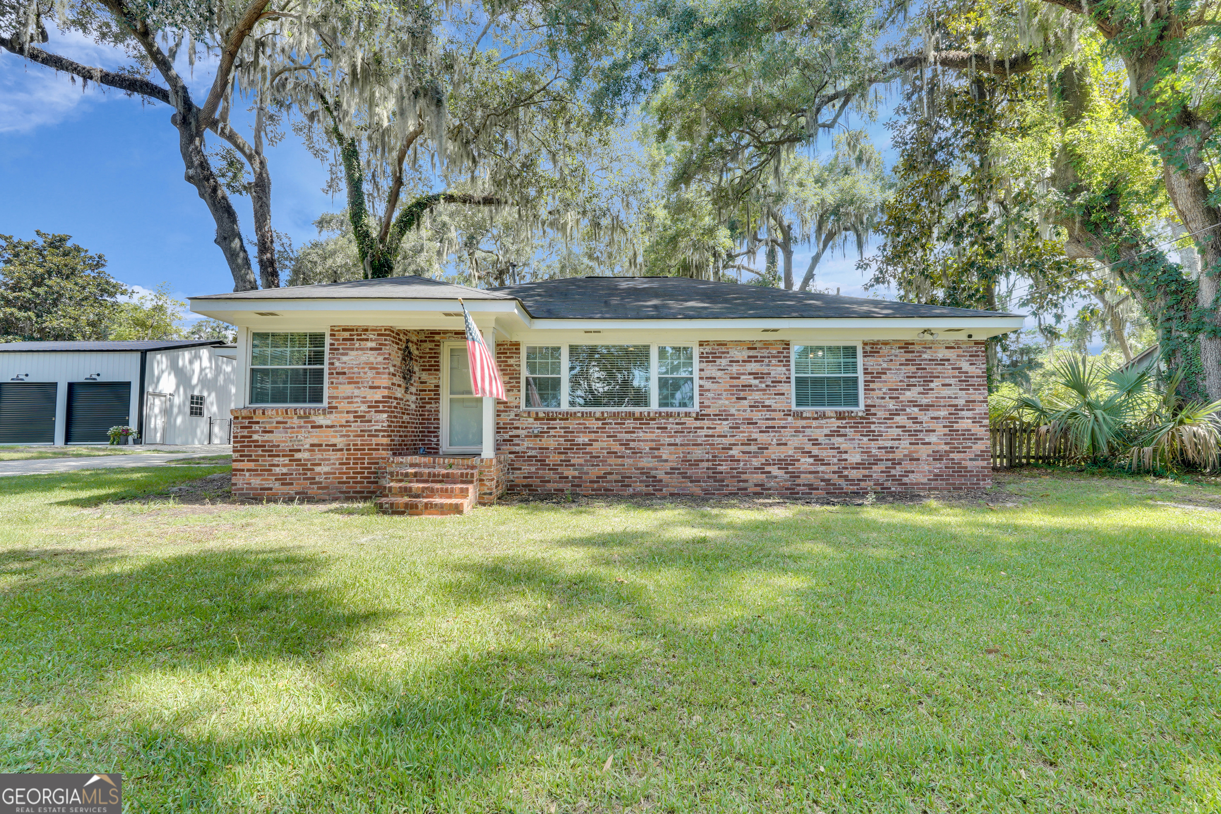 Discover your dream home on this serene street overlooking the marsh, just a short drive from a playground and public boat ramp! This stunning 3 bedroom, 2 bath hidden gem boasts a spacious, fenced-in backyard and over $100,000 worth of incredible updates, including an above-ground pool, new appliances, an updated HVAC system, a new water heater, a beautifully remodeled kitchen, a detached garage built in February 2025, and too many other updates to list! Located less than 10 minutes from Hunter Army Airfield, and less than 20 minutes from Downtown Savannah.