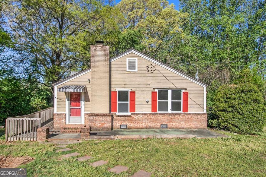Run, don't walk to this charming ranch-style home in Mableton situated on a large 1-acre lot! With a little TLC, it can be the perfect home for a first-time buyer or the savvy investor looking to buy and hold! This freshly painted, move-in-ready property features an open-concept floor plan complete with a fireside family room and brand-new carpet! You'll love the convenience of being a 5-minute drive to Heritage Park, 6 minutes to Publix and Walmart, and just 15 minutes to Smyrna Market Village and everything it has to offer!  *No Blind Offers Will Be Considered*