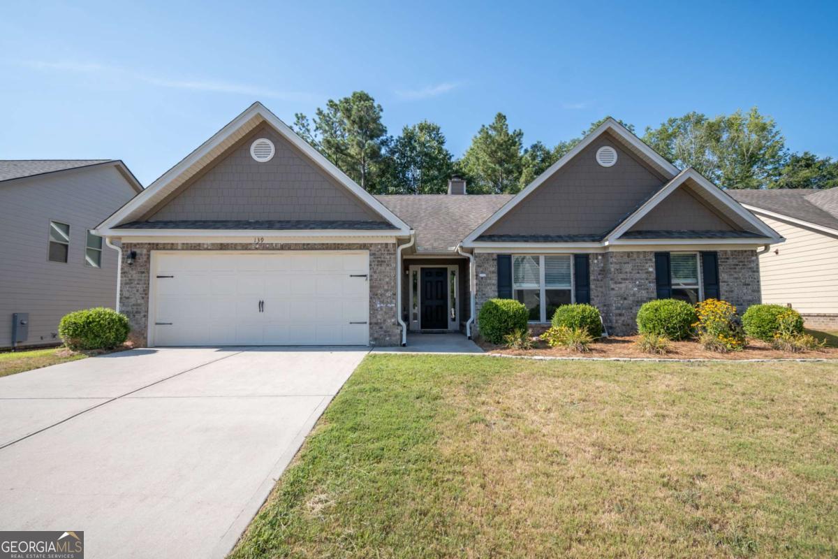 Beautiful 4bedroom 2.5 bathroom ranch. Screened porch leads to privacy fenced in back yard. Kitchen with granite counters, large island, full pantry and lots of cabinets. Vaulted ceilings, great room with fireplace, master suite with large walk-in closet, bath with separate shower and dual vanities. Big Screen TV stays. Call Frank to show.