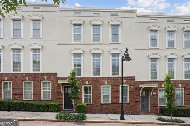 PHENOMENAL one bedroom Parisian style townhouse in Meeting Park! Wait till you see this place, on a private quiet tree lined street, with a one car garage, and the neighborhood has a wonderful pool and several gathering spaces for residents! All new paint throughout including hip grey cabinets, quartz counters, all new hardware, brand new carpet in the bedroom, and real hardwoods throughout the first two levels. Huge windows let in tons of natural light. HOA takes care of exterior maintenance, roof, several parks and the pool.