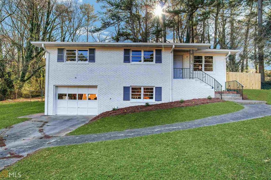 Welcome home to this fully renovated charmer in Smyrna's popular Hurt Park neighborhood! Every surface has been updated in this classic brick ranch over an unfinished basement. This tasteful renovation features designer paint colors inside and out, trendy light fixtures, and newly refinished hardwood flooring throughout. No carpet! Gorgeous kitchen is the hub of the home with new white cabinets, stone counters, tile flooring, stainless steel appliances and the coolest geometric tile backsplash! Separate dining room area showcases a special accent wall treatment.Main level owner's suite showcasing a brand new ensuite bathroom, a great spot to prepare for the day or wind down in the evenings. Recently added mudroom is perfect for laundry and additional storage off the garage! The unfinished basement offers incredible options for future expansion however you like. Outside, there is a private courtyard just off the kitchen that overlooks the massive fenced backyard with gorgeous trees and ample privacy. Ideal location is just minutes to all the fun at Smyrna Market Village and the Battery plus easy access to the I-75/285 junction. Don't miss this one!