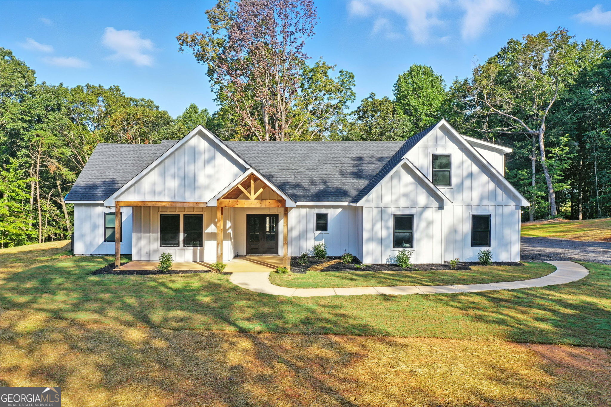 New Construction 5 bed/3.5 bath on 5.04 acres in Town Creek Estates-Talking Rock, GA. Welcome to this stunning 3,868 sq ft new construction estate offering 5 bedrooms, 3.5 bathrooms with large upstairs bonus room/teen suite, all thoughtfully designed on a spacious slab foundation. Nestled on 5.04 serene acres in the sought after Town Creek Estates. This home combines modern luxury with functional living. Step inside to an open concept floor plan that flows beautifully throughout. The main level features three generously sized secondary bedrooms with large closets each set apart on their own private wing. On the opposite side of the home, the right wing is dedicated to the luxurious master suite, complete with a spa inspired bath, oversized walk in closet, and a conveniently located laundry room. Upstairs you'll find the fifth bedroom with its own private bathroom. Perfect for use as a guest suite, home office, playroom, or additional storage space. Adding even more opportunity, this property includes a framed 1,100 sq ft AUD/in-law suite. Already studded and ready for completion, its a blank canvas for your vision-ideal for extended family, rental opportunity, additional garage, or workshop. Located just minutes from local wineries, nature parks, shopping, restaurant's, easy access to Interstate 515, and just 10 minutes to Downtown Ellijay. This home offers both privacy and convenience. Come experience everything Talking Rock has to offer-schedule your showing today!