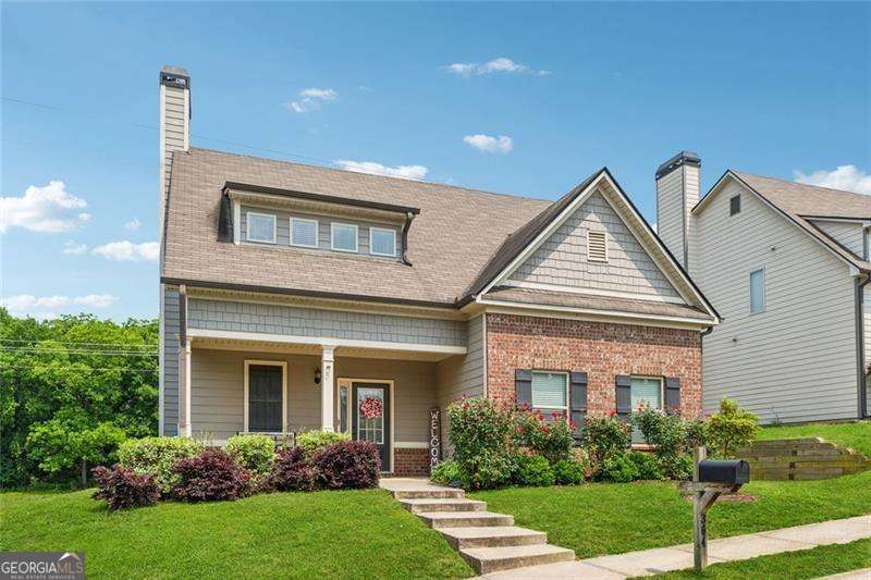 Welcome to your next chapter in the heart of Hoschton! This beautifully maintained 4-bedroom, 3.5-bath home sits in the sought-after Brook Glen community and offers the perfect blend of space, style, and smart living. Step inside to a bright, open main level where the focal-point kitchen shines with new appliances, a large island, and seamless flow into the cozy fireside living room-perfect for everyday living or entertaining. The primary suite is conveniently located on the main floor, with a spacious walk-in closet and a spa-inspired bath featuring double vanities, a soaking tub, and separate shower. Upstairs offers even more flexibility with a large bonus/media room, a loft area, and three generously sized secondary bedrooms-all with walk-in closets and access to two full bathrooms. This smart home comes equipped with modern upgrades and tech-savvy features, and sits on a private lot with access to community amenities including a pool, tennis courts, and sidewalks throughout. Located just minutes from Downtown Braselton, top-rated Jackson County schools, and surrounded by exciting new growth and development, this home offers convenience now-and great potential for the future. USDA Approved, $0 down!