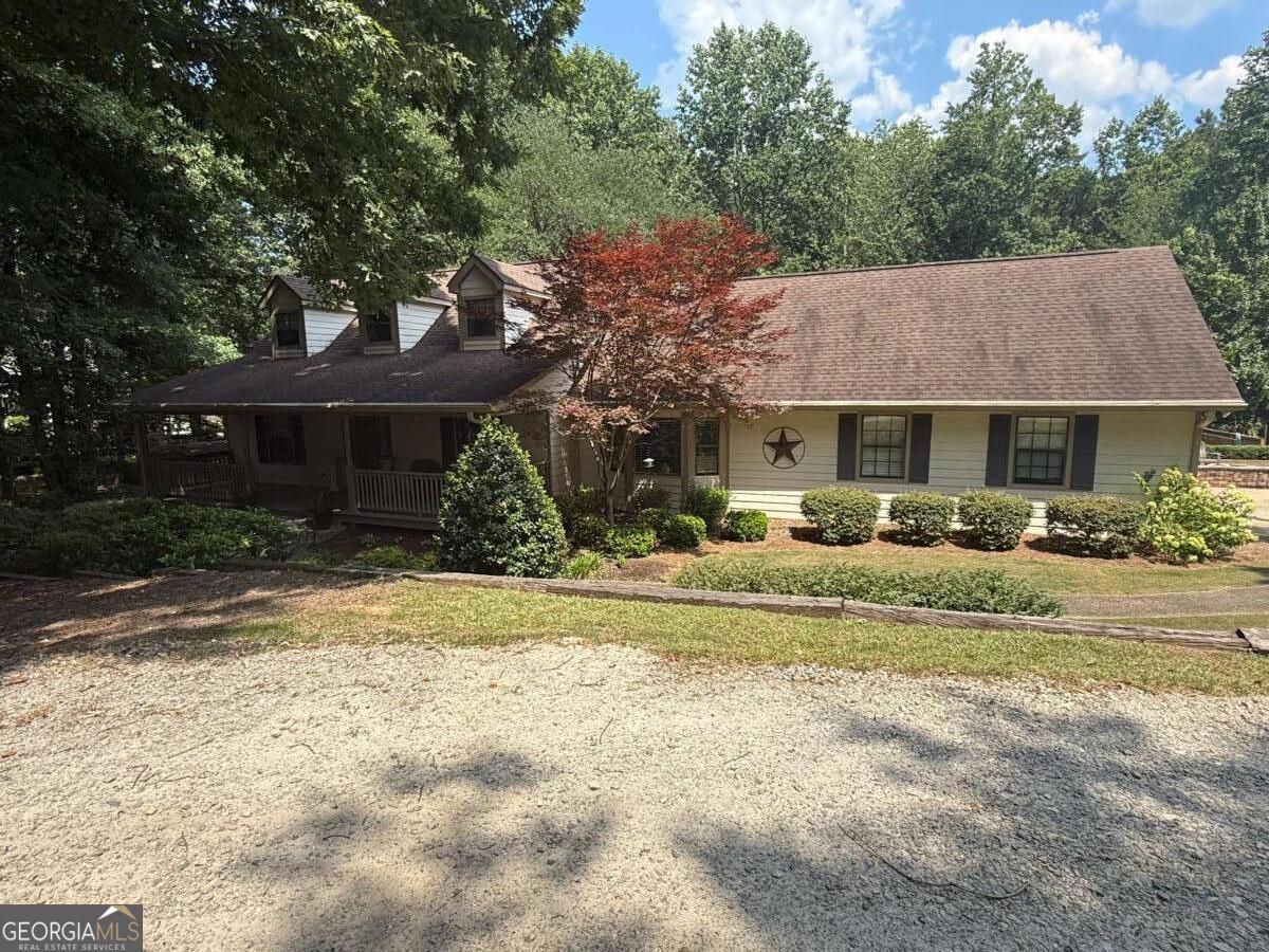Welcome to 5497 Hwy 81 in Loganville, a spacious and beautifully maintained home offering the perfect blend of comfort, privacy, and versatility. This five-bedroom, three-bathroom residence sits on over three peaceful acres featuring a serene creek on the property, providing a natural retreat right in your own backyard - and with no HOA, you're free to bring your RV, boat, or any other toys. With over 3,500 square feet of living space, this home offers a highly desirable layout, including a primary bedroom conveniently located on the main level. The inviting eat-in kitchen is both functional and charming, complete with built-in benches that include storage underneath - perfect for family meals and casual mornings. Step outside to enjoy your private oasis, featuring a beautiful above-ground pool surrounded by a custom deck and a huge back porch ideal for entertaining guests or relaxing with family. The finished full basement offers incredible flexibility, fully equipped as an in-law suite or potential income-producing apartment with its own kitchen and laundry area, making it perfect for extended family or guests. Inside, you'll find quality finishes throughout, including a high-end Cove dishwasher by Wolf in the main kitchen, adding a touch of luxury and everyday convenience. This property combines generous living space, thoughtful details, and over three acres of natural beauty - all in a peaceful Loganville setting. Whether you're looking for a spacious family home, a multi-generational living setup, or an opportunity to generate rental income, 5497 Hwy 81 is truly a special find.