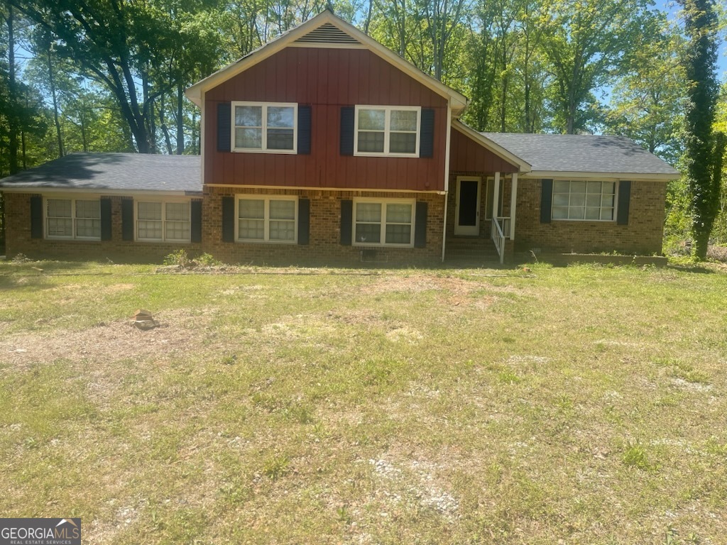 CHARMING STARTER HOME WITH POTENTIAL-Ideal for First Time Buyers! Welcome to this inviting 4-bedroom,3-bath home that offers a great opportunity to add your personal tough! Featuring a mix of ceramic tile, carpet, and wood flooring throughout, this home has hardwood floors hidden beneath the carpet in the bedrooms and hallways-just waiting to be uncovered and restored. Enjoy spacious layout with separate living and dining room perfect entertaining. Step down into cozy family room with wood burning fireplace and sliding glass doors leads out to patio-ideal spot for relaxing or hosting gatherings. Eat-in kitchen also opens up to a large deck through another set of glass doors, creating a wonderful indoor-outdoor flow. Home is on a private 1 acre lot. No HOA. Up to 12,000 in down payment. thru Georgia Dream. Up to 3000 in lender-paid closing costs available with preferred lender and qualifying loan programs. Whether you're a first-time buyer or looking for a smart investment, this home offers space, functionality, and value in a growing area. Don't miss your chance to make it your own. '