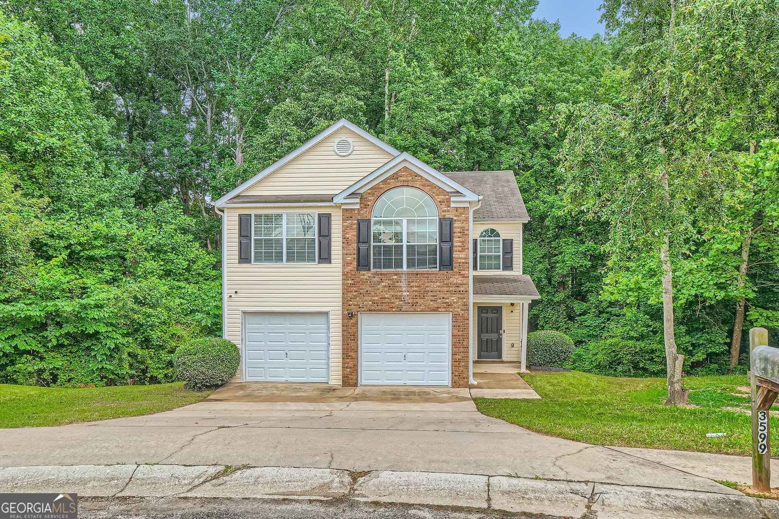 Welcome to this well maintained home, perfectly situated on a spacious cul-de-sac lot in a established neighborhood-just minutes from shopping and I-85. Step inside an inviting layout featuring 3 bedrooms and 2.5 bathrooms. The main floor offers a living room centered around a charming fireplace, ideal for relaxing or entertaining. The kitchen flows seamlessly into the adjacent dining room. From here, step out onto the large back deck-perfect for outdoor dining and gatherings. Upstairs, unwind in your master suite complete with an en-suite bathroom, featuring a soaking tub and separate shower. Two additional bedrooms provide flexible space for family, guests, or a home office. Outside you have a 2-car garage offering both parking and storage.