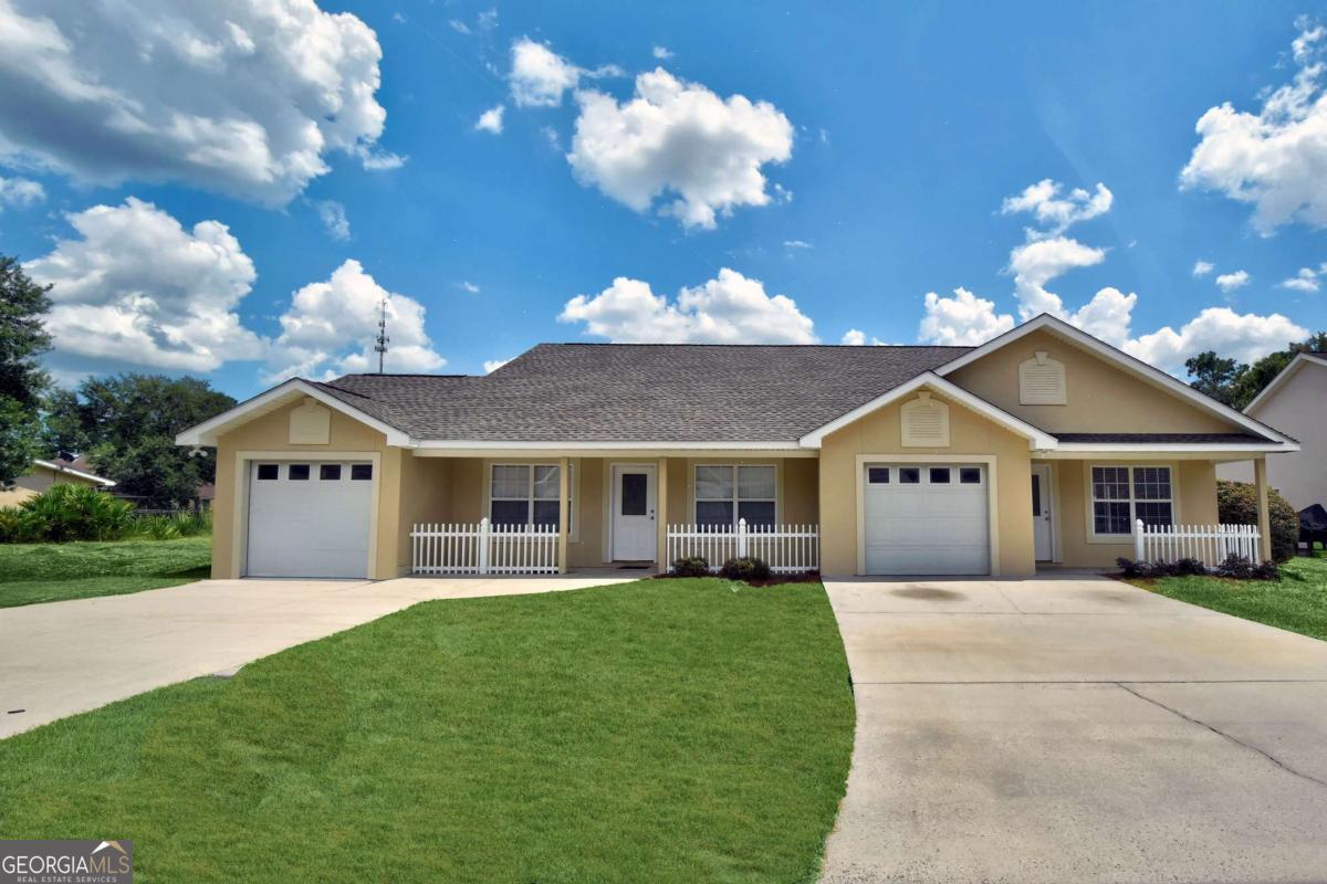 Welcome to Millcrest - a peaceful, tree-lined community conveniently located near all that Brunswick has to offer, just 20 minutes from Darien, St. Simons and Jekyll Islands. Known for its clean, family-friendly environment, Millcrest features primarily patio-style duplex homes built between 2001 and 2004. Homes range from 2,500 to 3,400 square feet, typically offering 2 to 4 bedrooms and 2 to 4 bathrooms. Each duplex must be purchased as a full unit, making it especially attractive to first-time homebuyers seeking supplemental income or investors looking for strong rental potential. This particular duplex features a brand-new roof (2025) and fresh exterior paint, along with new bedroom carpeting. Inside, you'll find thoughtful details like an open floor plan, a tray ceiling in the primary bedroom, double vanities, a flex room in addition to the second bedroom which is ideal for a study or den, and a 1-car garage. One side of the home enjoys peaceful lake views, adding to the property's appeal. This unit includes $5,000.00 towards closing costs to be paid by the seller. Whether you're looking to live in one side and rent the other, or lease out both for maximum income, this well-maintained duplex offers excellent flexibility. Each unit includes 2 bedrooms, 2 bathrooms, and a 1-car garage. If this specific layout doesn't meet your needs, additional duplexes in Millcrest will be available.