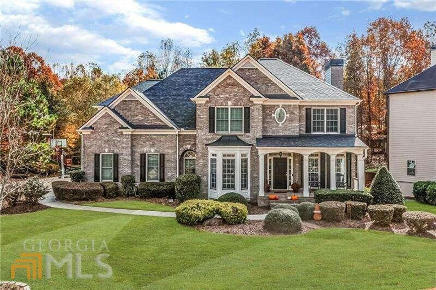 STUNNING 5 bedroom / 4 bath home with 3-SIDES BRICK in highly sought after Olde Heritage neighborhood! Step into open foyer that welcomes you into spacious formal dining room and beautiful office space with gorgeous French doors. MAGNIFICENT VIEWS, as you step into 2-STORY LIVING ROOM, which looks out to beautifully wooded backyard and is complete with cozy FIREPLACE! Open concept kitchen features gorgeous NEWLY PAINTED WHITE CABINETS, granite countertops, gas cooktop, and an abundance of cabinets/storage! Kitchen also boasts cozy EAT-IN BREAKFAST AREA, kitchen island, and half bath. Spacious deck off kitchen is perfect for is perfect for entertaining or family BBQCOs! Upper level features OVERSIZED PRIMARY BEDROOM with large sitting area with custom built-ins, and lots of windows for natural light. Primary bath features vaulted ceilings and direct access to OVERSIZED CLOSET! Upper level also features three additional bedrooms, one with en-suite bath, and the other two sharing a Jack-and-Jill bath. Beautifully finished basement is complete with optional 5th bedroom, full bath, workout room, and media area with custom built-ins. Bay window provides unique space for an art studio, additional work space, or make it your own! Basement also has spacious unfinished area for storage. Last but not least, sit around the cozy BACKYARD FIRE PIT and enjoy the beautifully wooded, FENCED back yard! Some of the other features included in this gorgeous home are NEW ROOF 2020, NEW CARPET, NEW FIREPLACE INSERT, NEW GARAGE DOOR, UPDATED HARDWOODS, UPDATED SECURITY SYSTEM, AND CUSTOM FIXTURES ADDED THROUGHOUT! Centrally located with easy access to DT Woodstock, Canton, Alpharetta, Milton, and Roswell. Once you see this gorgeous home, you will want to make it your own!