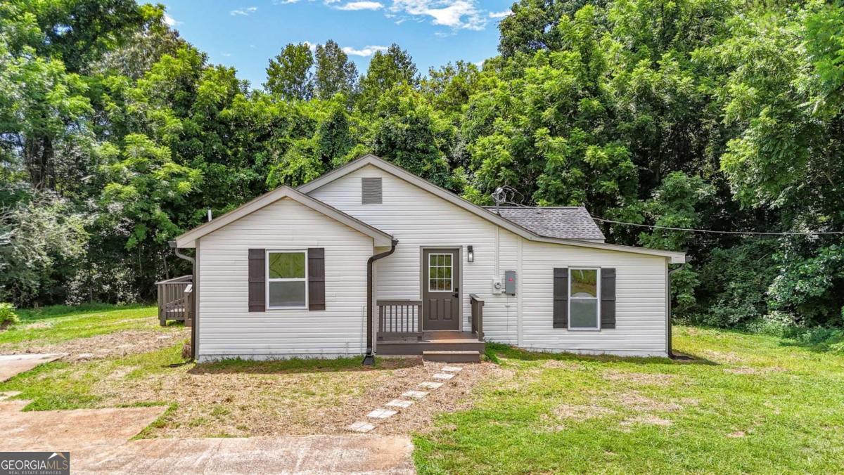 Come see this beautifully renovated ranch-style home offering modern updates and timeless charm. This 3-bedroom, 2-bath gem features brand-new Luxury Vinyl Plank flooring throughout, a new roof, fresh interior and exterior paint, new HVAC system, updated lighting and plumbing fixtures, and new quartz countertops in both the kitchen and bathrooms. The bright and inviting living room features large windows with views into the updated kitchen, which boasts quartz counters, stainless steel appliances, and a separate dining area. The spacious primary suite includes a fully renovated en-suite bath with all-new tile, double vanity with quartz counters, and a low-flow toilet. Two additional bedrooms share a beautifully updated hall bath with granite countertops, a low-flow toilet, and a tub/shower combo. Enjoy the charming front porch and entertain on the brand-new back deck-perfect for grilling and relaxing.