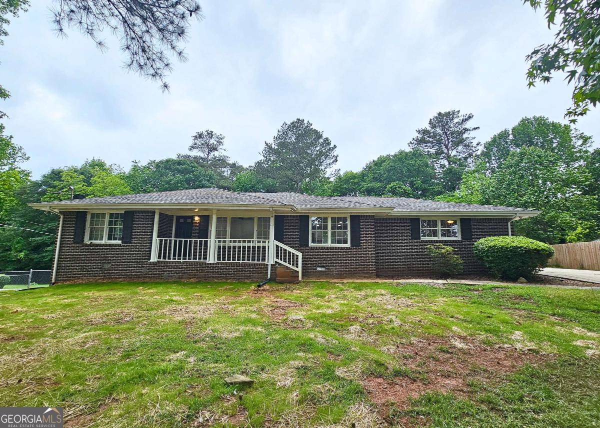Delightful 4 bedroom & 3 bath ranch home. Updated kitchen while enjoying your beautiful back yard. Here's place to leave home right into your office or personal large man cave. Home expanded to meet additional family needs. Brick ranch home with hard wood floors just as nice for your pets. You need more space for out town guest this is for you.