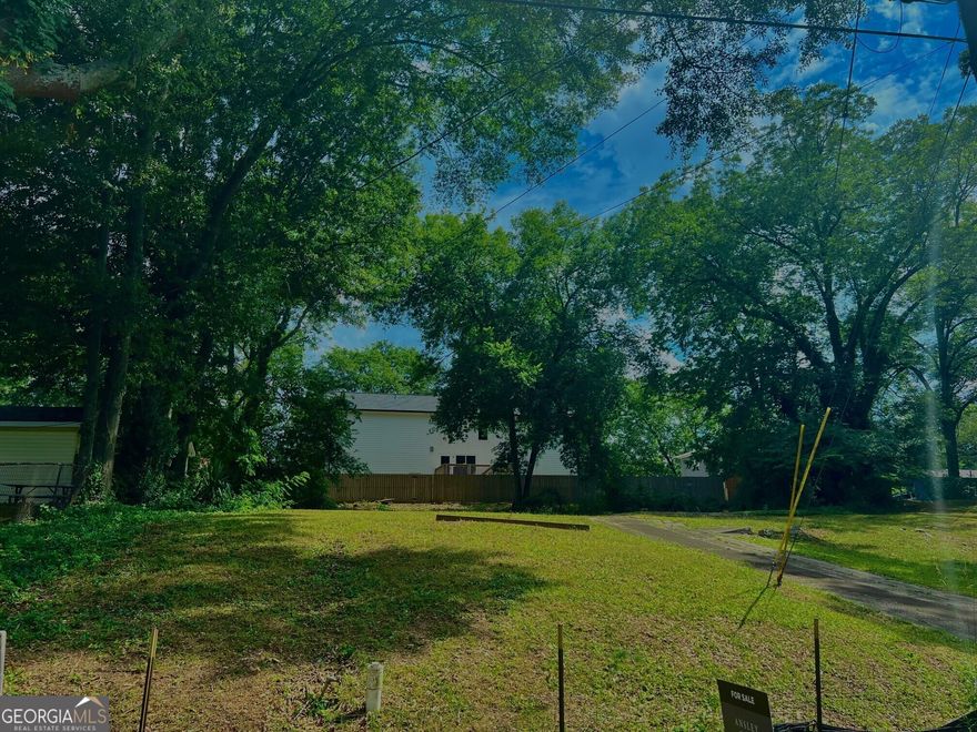 AWESOME buildable lot close to the Historic Marietta Square!  Bring your own builder and build your dream house, or use our Award Winning Builder - Uppercut Homes (Ben Burney).  The lot is developed and cleared and is 130 feet x 53 x 121 x 53 - just over 1/3 of an acre.  Private street without much cut through traffic.  Feel free to walk the lot.