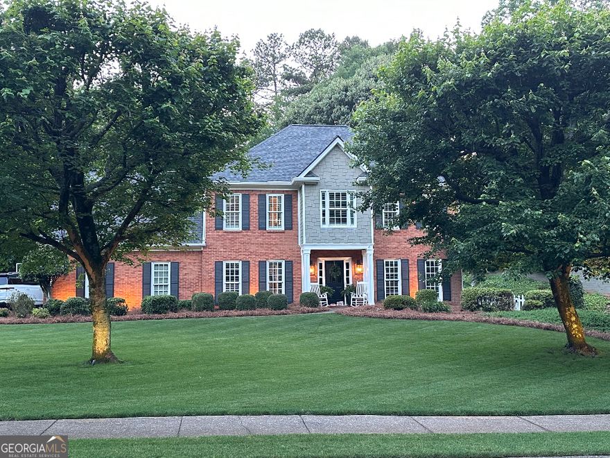 Welcome to this beautifully maintained 5-bedroom, 2.5-bathroom home that blends classic style with modern comfort in the highly sought-after swim/tennis community of West Hampton! Situated on a spacious, flat lot, this home boasts large front and back yards complete with a fully functioning irrigation and sprinkler system. The exterior features classic brick construction with Hardi plank siding, PVC soffit and fascia, double-pane windows, and a brand-new roof installed in November of 2023-offering long-lasting durability and curb appeal.    Inside, you'll find gorgeous hardwood floors throughout, plush new carpeting on both front and back staircases, and extensive custom trim work that enhances the home's elegance. The downstairs layout includes a formal living and dining room, a cozy family room, and a sunlit breakfast nook adjacent to the kitchen. The modern kitchen is a chef's dream, featuring quartz countertops, stainless steel appliances, a deep stainless steel sink, white cabinetry with under and over cabinet lighting, a built-in hall tree with additional cabinetry for storage, and a spacious walk-in pantry.    Upstairs, the home offers five spacious bedrooms, perfect for families or those needing a home office or playroom. The oversized primary suite features a luxurious en-suite bathroom with a soaking tub, double marble vanities, and marble and porcelain tile flooring. A second full bathroom completes the upper level.    Step outside to the fenced backyard oasis, where you'll enjoy a brick-paved sitting area, flagstone patio, and a charming tree swing-perfect for relaxing or entertaining guests!    Residents of West Hampton enjoy access to a junior Olympic-sized swimming pool, tennis and pickleball courts, and a beautiful clubhouse perfect for neighborhood gatherings and events. It's a family-friendly, active community that feels like home the moment you arrive. Located in the top-rated school districts of Due West Elementary, McClure Middle, and Harrison High School, this home truly offers the best of comfort, community, and convenience!