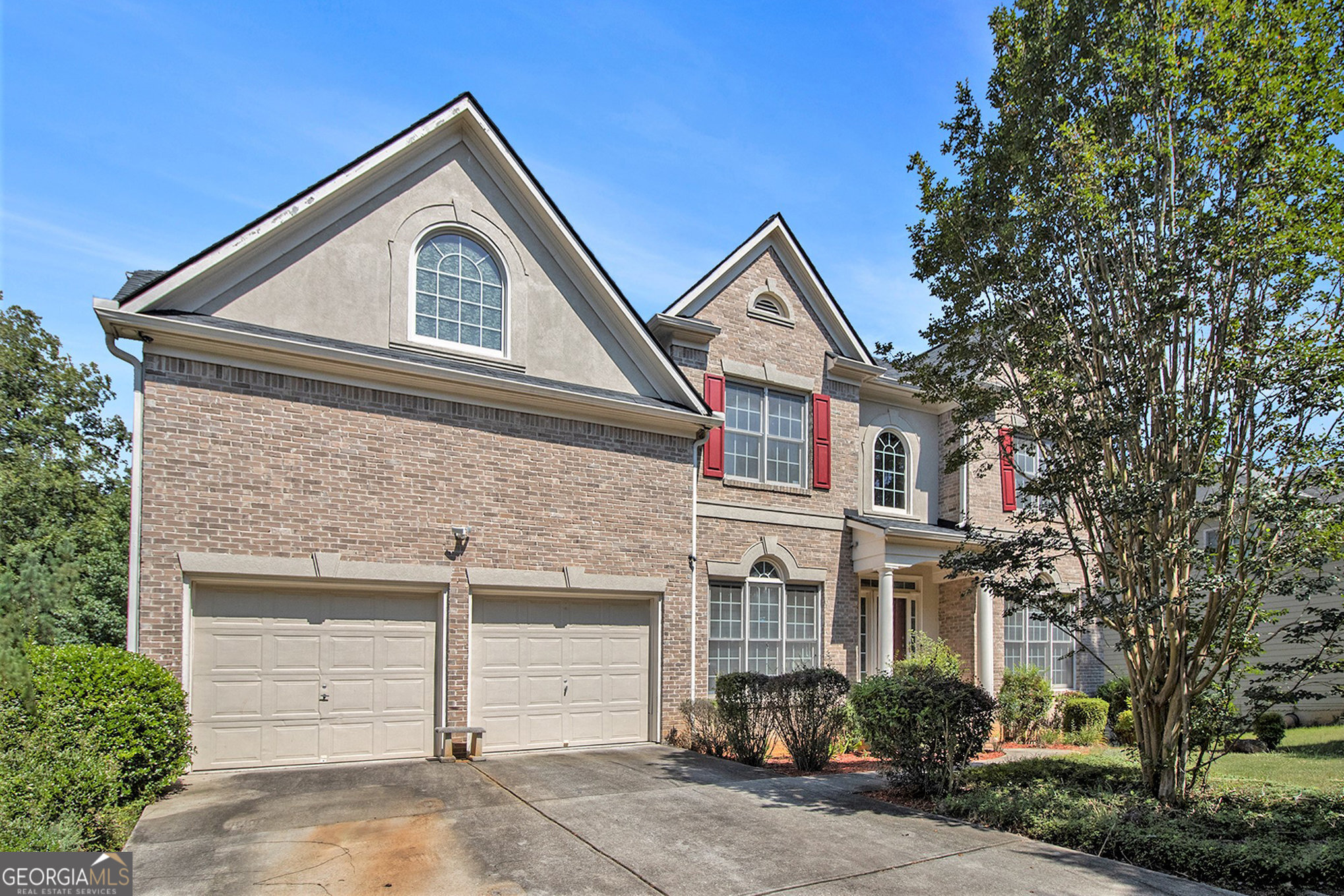 Welcome to this spacious 5-bedroom home nestled in the vibrant Lakes of Cedar Grove community! Larger than most homes in the subdivision and priced to sell, this property is ready for your personal touches. Step inside to hardwood floors, a formal dining room with a charming bay window, and a bright, open-concept layout perfect for everyday living and entertaining. Upstairs, retreat to the generous primary suite featuring a beautifully appointed bathroom ideal for relaxation. The finished basement adds even more value with a second kitchen, a dedicated office space, and a fully renovated bathroom, perfect for guests or extended living. Enjoy the outdoors with a scenic lake just steps from your front door, as well as access to resort-style amenities including multiple pools, tennis courts, three serene lakes, and a clubhouse. To the left of your home is the walking trail that wraps around the lake; to the right, the community pool and playground. All of this is tucked away on tree-lined streets in a prime location near downtown Atlanta and Hartsfield-Jackson Airport. Don't miss your chance to own one of South Fulton's most desirable communities!