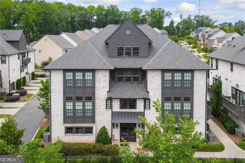 Welcome to an exquisite one-bedroom townhome located in the prestigious gated community of Serenade, situated in Alpharetta, GA. Nestled comfortably just outside the vibrant city of Atlanta in North Fulton County, this residence offers a unique blend of luxury and convenience. Built in 2019 by Ashton Woods, the Beethoven plan spans over 1,600 square feet and is designed to cater to your modern lifestyle needs. An open-concept kitchen, dining, and living area seamlessly blends together, perfect for hosting gatherings or enjoying quiet evenings in. The kitchen is well-appointed with everything you need to prepare gourmet meals, while the living area offers a comforting retreat. The spacious primary suite is truly remarkable, boasting a spa-like bath and an expansive closet offering abundant storage space plus a laundry area for added convenience. Enjoy breathtaking sunrises right from the comfort of your bedroom window. Additionally, the home includes a versatile flex room with a full bath that can be adapted to suit your needs, whether it be a home office, gym, or guest room. One of the distinct advantages of this property is its attached two-car tandem garage, offering ample storage and convenience. Unlike many other condos, this townhome is uniquely designed with no neighbors above or below, ensuring maximum privacy and tranquility. The Serenade community in Alpharetta, GA, is replete with amenities that elevate your living experience. Residents can enjoy relaxing by the pool, taking leisurely strolls through the serene garden trails, or unwinding at the gazebo. Its strategic location places you within walking distance of the Ameris Bank Amphitheater, making concert nights an effortless pleasure. For those inclined towards retail therapy, the upscale shops and dining options at Avalon and downtown Alpharetta are minutes away. Don't miss out on this opportunity to own a piece of serenity in one of Alpharetta's most coveted communities. Come, experience the ideal blend of comfort, convenience, and sophisticated living at Serenade in Alpharetta, GA.