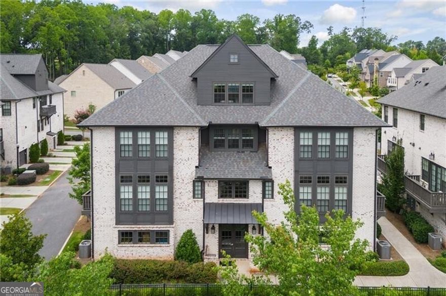 Welcome to an exquisite one-bedroom townhome located in the prestigious gated community of Serenade, situated in Alpharetta, GA. Nestled comfortably just outside the vibrant city of Atlanta in North Fulton County, this residence offers a unique blend of luxury and convenience. Built in 2019 by Ashton Woods, the Beethoven plan spans over 1,600 square feet and is designed to cater to your modern lifestyle needs. An open-concept kitchen, dining, and living area seamlessly blends together, perfect for hosting gatherings or enjoying quiet evenings in. The kitchen is well-appointed with everything you need to prepare gourmet meals, while the living area offers a comforting retreat.  The spacious primary suite is truly remarkable, boasting a spa-like bath and an expansive closet offering abundant storage space plus a laundry area for added convenience. Enjoy breathtaking sunrises right from the comfort of your bedroom window. Additionally, the home includes a versatile flex room with a full bath that can be adapted to suit your needs, whether it be a home office, gym, or guest room.  One of the distinct advantages of this property is its attached two-car tandem garage, offering ample storage and convenience. Unlike many other condos, this townhome is uniquely designed with no neighbors above or below, ensuring maximum privacy and tranquility.  The Serenade community in Alpharetta, GA, is replete with amenities that elevate your living experience. Residents can enjoy relaxing by the pool, taking leisurely strolls through the serene garden trails, or unwinding at the gazebo. Its strategic location places you within walking distance of the Ameris Bank Amphitheater, making concert nights an effortless pleasure. For those inclined towards retail therapy, the upscale shops and dining options at Avalon and downtown Alpharetta are minutes away.  Don't miss out on this opportunity to own a piece of serenity in one of Alpharetta's most coveted communities. Come, experience the ideal blend of comfort, convenience, and sophisticated living at Serenade in Alpharetta, GA.