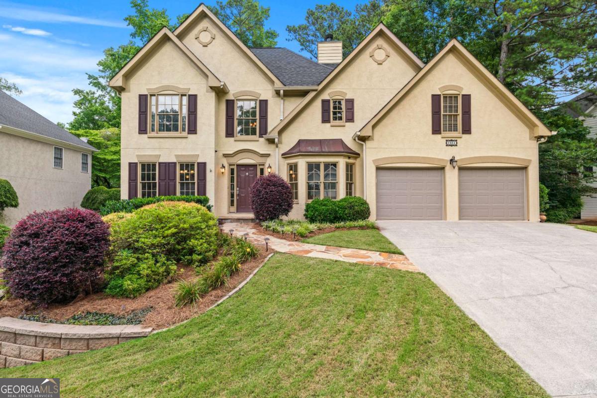 Come home to this beautiful, move-in ready 4-bedroom, 2.5-bath home on a full daylight basement near a cul-de-sac in Wyndcliff-a sought-after East Cobb swim/tennis neighborhood with a clubhouse and covered pavilion at the courts. The sellers are sad to leave a home they've lovingly invested in, but excited for someone new to enjoy all it offers! Hardwood floors run through the main level, complemented by brand-new carpet upstairs, HGTV-worthy colors, and high-end finishes throughout. The kitchen and baths feature stone counters, and the oversized master suite is a true retreat-complete with a separate sitting room and gas fireplace, double tray ceiling, and space for large furniture. The ensuite bath boasts a glass-enclosed shower, relaxing whirlpool tub, double vanity, private water closet, and two spacious walk-in "his-and-her" closets. Three additional large bedrooms share a "Jack-and-Jill" bath with double vanities. Downstairs, a dramatic two-story foyer is flanked by a formal dining room with upgraded trim package and a flexible room perfect as a living room, library, or music space. From there, step into the heart of the home-an entertainer's dream-with an open-concept kitchen, breakfast area, and vaulted great room featuring soaring windows and a stone gas fireplace with views to an amazing backyard. The kitchen includes granite counters, plentiful white cabinets, stainless steel appliances including a gas range, a large island, and walk-in pantry. A half-bath and laundry room complete the main level. Just off this amazing living space, step onto the newer ground-level deck and into a serene, fenced backyard with lush grass, mature landscaping, a vegetable and berry garden, and a convenient outdoor storage building. The full daylight basement offers a spacious finished room and generous unfinished space for storage or future expansion. (The basement has great bones for expansion and is stubbed for a bathroom!) Two-car garage. Fantastic location close to schools, shopping, and commuter routes. If this feels like the one, let's talk!