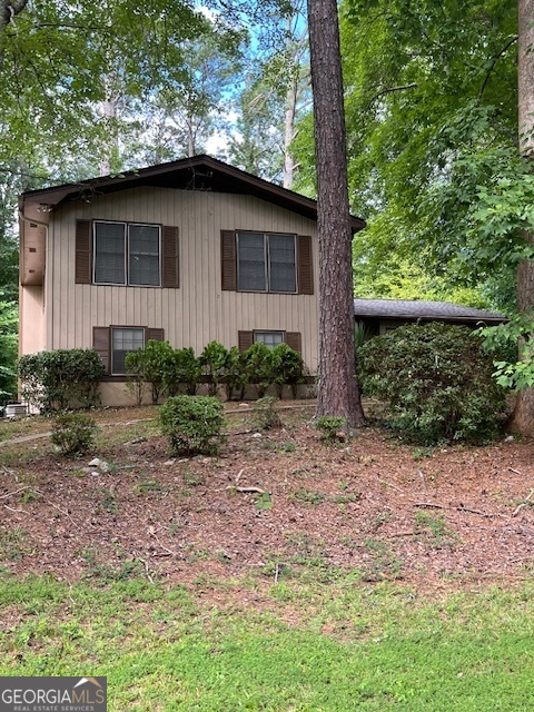 This charming split-level home features 4 bedrooms, 2.5 baths, and ample living space. Enjoy formal living and dining areas, an eat-in kitchen, and a family room with a built-in bar. Perfect for entertaining and family living. It is located close to schools, parks, and shopping.
