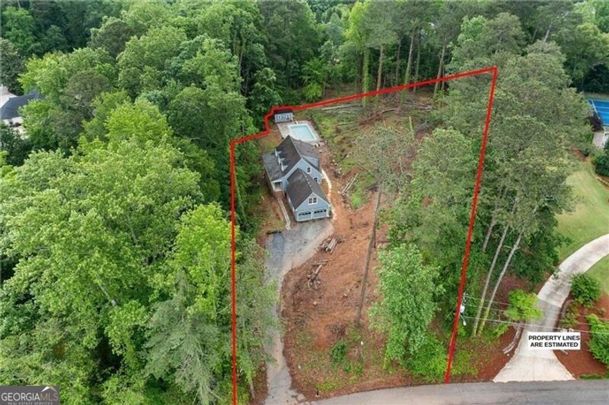 Builder/Developer Opportunity - 1.2 Acres in Prime East Cobb Location! Located near Paper Mill and Johnson Ferry, this rare 1.2-acre sloped lot offers exceptional potential for a custom luxury build in one of East Cobb's most prestigious areas. The property has already been cleared of trees, providing a head start for development, and the natural elevation allows for creative architectural design-ideal for homes with walk-out basements or multi-level layouts. An existing 4-bedroom, 2.5-bath structure sits on the lot and could be renovated or removed to make way for new construction. Surrounded by high-end homes and zoned for award-winning schools, this site is just minutes from fine dining, shopping, the Chattahoochee River National Recreation Area, Atlanta Country Club (ACC), and hiking. Opportunities like this are increasingly rare-don't miss your chance to build in one of Cobb County's most sought-after neighborhoods!
