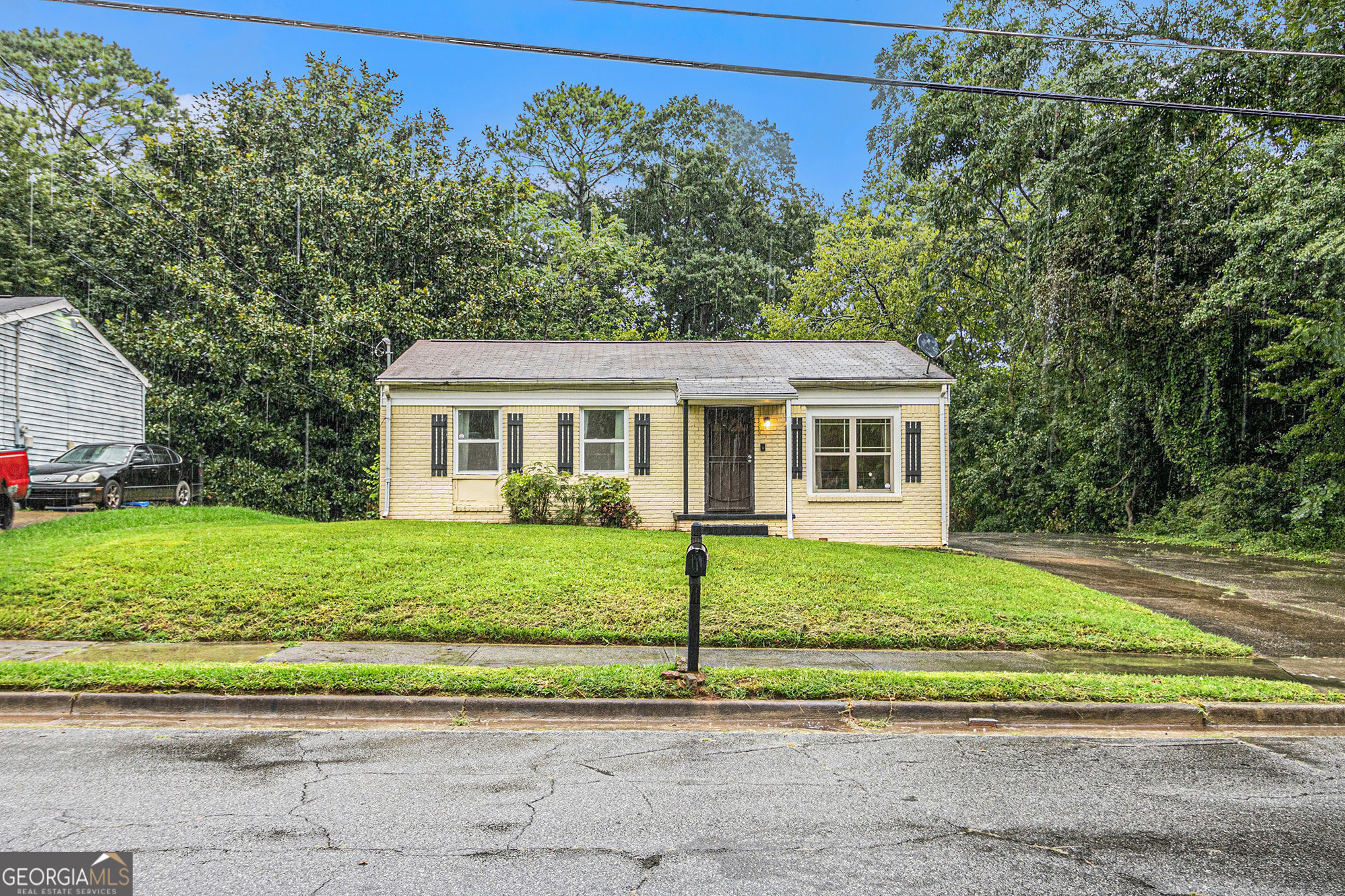 Charming 3-bedroom, 2-bath brick-front bungalow nestled on a spacious 0.50-acre lot! This inviting home offers covered front porch, Inside a warm and functional layout with a cozy living area, a spacious kitchen, and generously sized bedrooms. The primary suite includes a private bath for added comfort. Step outside to enjoy the expansive yard perfect for gardening, outdoor entertaining, or future expansion. Conveniently located with easy access to shopping, dining, and major highways, this home blends comfort, charm, and room to grow!
