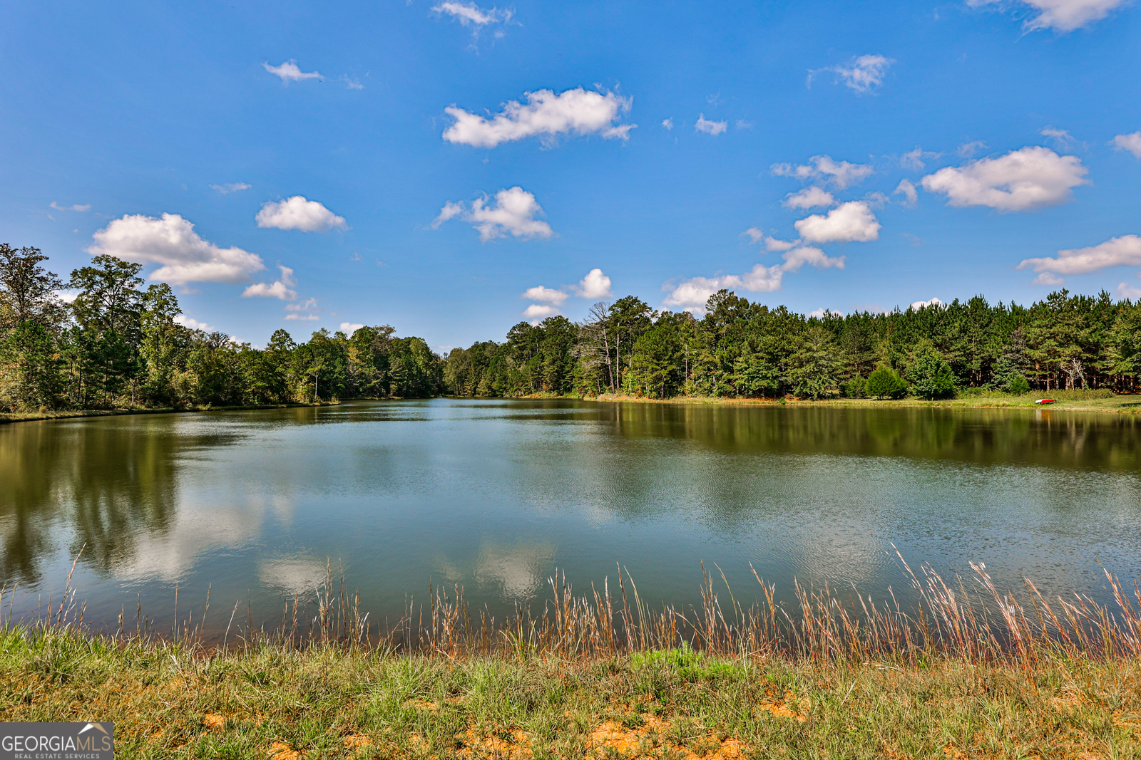 AFM Real Estate (AFMRE) is pleased to present the exclusive offering of Yellow River, located in Newton, County Georgia.  The property contains 589.5 contiguous acres of recreational and development property nestled in the heart of Georgia minutes from the thriving city of Covington, GA. These diverse acres offer a combination of size, habitat diversity, upland pine plantations and mature hardwoods.  The abundance of wildlife and water resources makes this a very appealing recreational and future development investment opportunity available in Metro Atlanta.  The Land - Timber, Recreation and Wildlife  The Yellow River Offering has been under an active timber and wildlife management plan for several decades.  The expansive acreage consists of upland merchantable and pre merchantable planted and natural pines, mature hardwoods, and large game plots.  The water features associated with this offering consist of a 10-acre stocked lake and over 7000 feet of scenic frontage along the Yellow River.  The property provides an attractive blend of manageable timberland recreational upside for both the avid sportsman and long-term investor.  Surrounded by developments, mini farms, industrial and commercial growth, The Yellow River Offering may ultimately prove to present one of the best opportunities for a premier investment property in recent years.    Property Highlights:  * 589.5 +/- Acres of Highly Productive Development and Recreational Land  * Paved Frontage along Highway 212 for approximately 1800 feet  * Over 7000 feet of scenic Yellow River Frontage   * 10 acre stocked lake  * 415 acre of well managed pine plantations   * 150 acres of natural mature hardwoods 8  * 8 miles to Downtown Covington and 10 miles to Mansfield  * Gently rolling topography - Development Ready  * 10 miles to I-20  * Utilities available   For a private tour or additional information, please contact Nathan Greer, Broker