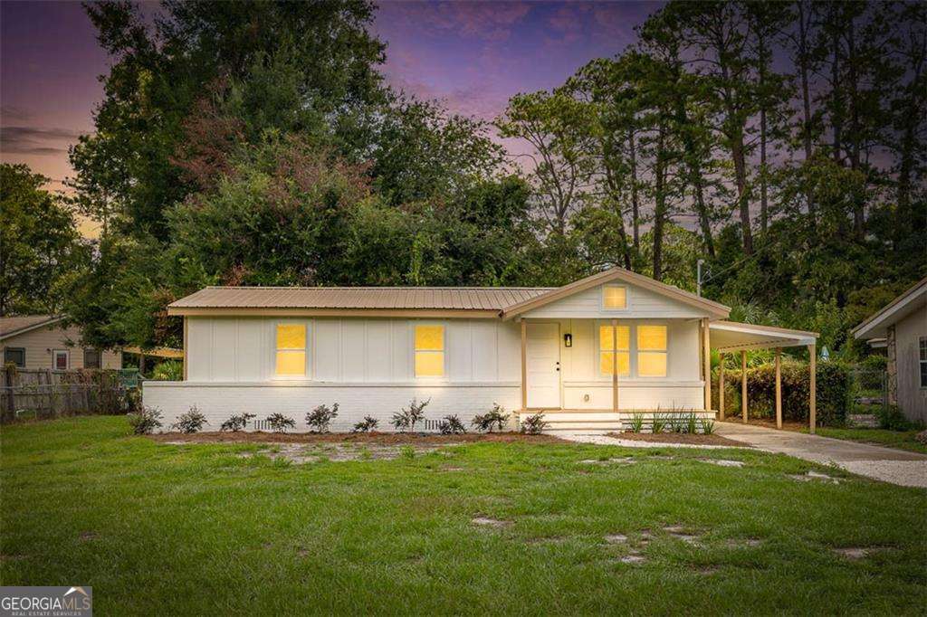 Fully Renovated 3BR/2.5BA Home! Move-In Ready & Perfectly Located! Step into this beautifully renovated 3-bedroom, 2.5-bath home offering 1,268 sq. ft. of stylish, functional living space. Situated just minutes from the hospital and college, this property is ideal for nurses, coastal college of Ga Attendees, first-time homebuyers, or investors looking for a prime location. The home features all-new stainless steel appliances plus a brand-new washer and dryer, & an instant hot water heater, making move-in a breeze. Enjoy the flexibility of a cozy den perfect for a home office, study space, or extra lounge area and the convenience of a covered carport for parking and storage. Every detail has been thoughtfully updated, so you can simply unpack and start living. Whether you're seeking a low-maintenance personal home or a smart investment in a high-demand rental area, this property checks all the boxes. - Close to shopping, dining, medical facilities, and campus - Move-in ready with modern finishes, new systems & no HOA. Don't miss your chance to schedule a showing today! Interactive floorplan can be viewed in the facts and features section by clicking virtual tour or you can Copy and paste this link to your browser to view it - https://youriguide.com/3314_n_cleburne_st_brunswick_ga/
