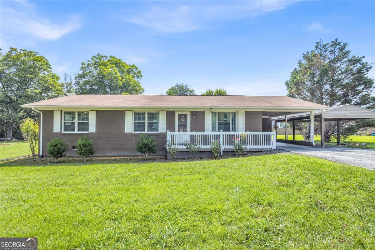 Don't miss this charming brick ranch nestled in the quiet Green Meadow subdivision! This 3-bedroom, 2-bath home features hardwood floors, an updated kitchen and bath, and a spacious screened back porch perfect for relaxing summer evenings. The level 0.46-acre lot offers mature landscaping and includes a large outbuilding - ideal for storage, a workshop, or hobbies. Located just minutes from I-75, Buc-ee's, downtown Calhoun, shopping, schools, and AdventHealth Gordon. Whether you're a first-time buyer, investor, or downsizing, this home offers a great value in a growing area!