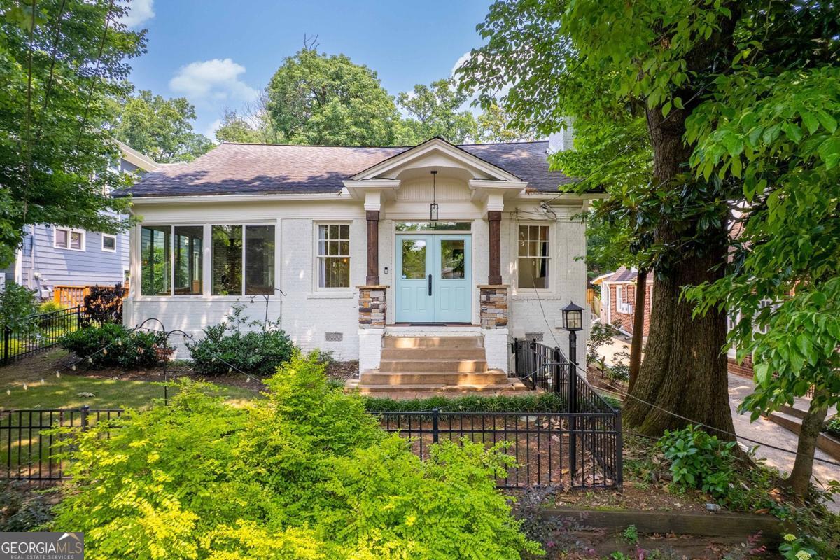 Wow, over $300k spent on recent renovation and addition! Don't miss this spacious brick bungalow that offers generous rooms in the heart of Virginia Highland!. Walk to coffee shops, restaurants, yoga & more along quiet tree lined streets in this historic neighborhood. This home now features 3 oversized bedrooms, 2 updated bathrooms, renovated gourmet kitchen, recently enclosed sunroom, open floorplan w/ high ceilings gives the home a bright airy feel. Level grassy backyard now includes a large pergola with firepit, additional seating and indirect lighting package that makes the yard feel cozy and romantic at night! Driveway features private parking pad and potential access to rear alley. Privacy fence installed and ability to add driveway gate in backyard. **Preferred lender pays up to $12,000 towards buyer's closing costs!**
