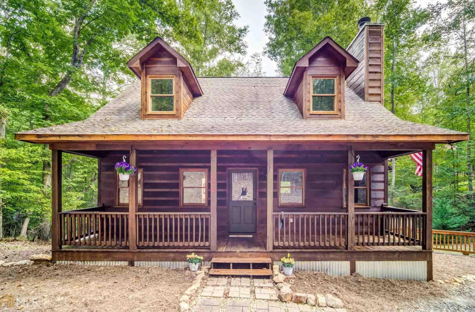 Come visit this newly updated cabin style home located in a very popular gated river resort community and end your searching! This home has plenty of room to spread out, including a large loft and 2 bonus rooms on the terrace level (one could easily be a 4th bedroom). Great room features floor to ceiling stacked rock wood burning fireplace, kitchen has lots of gorgeous hickory cabinets, granite counters, and open view to family room. Well appointed home. Laundry on main.