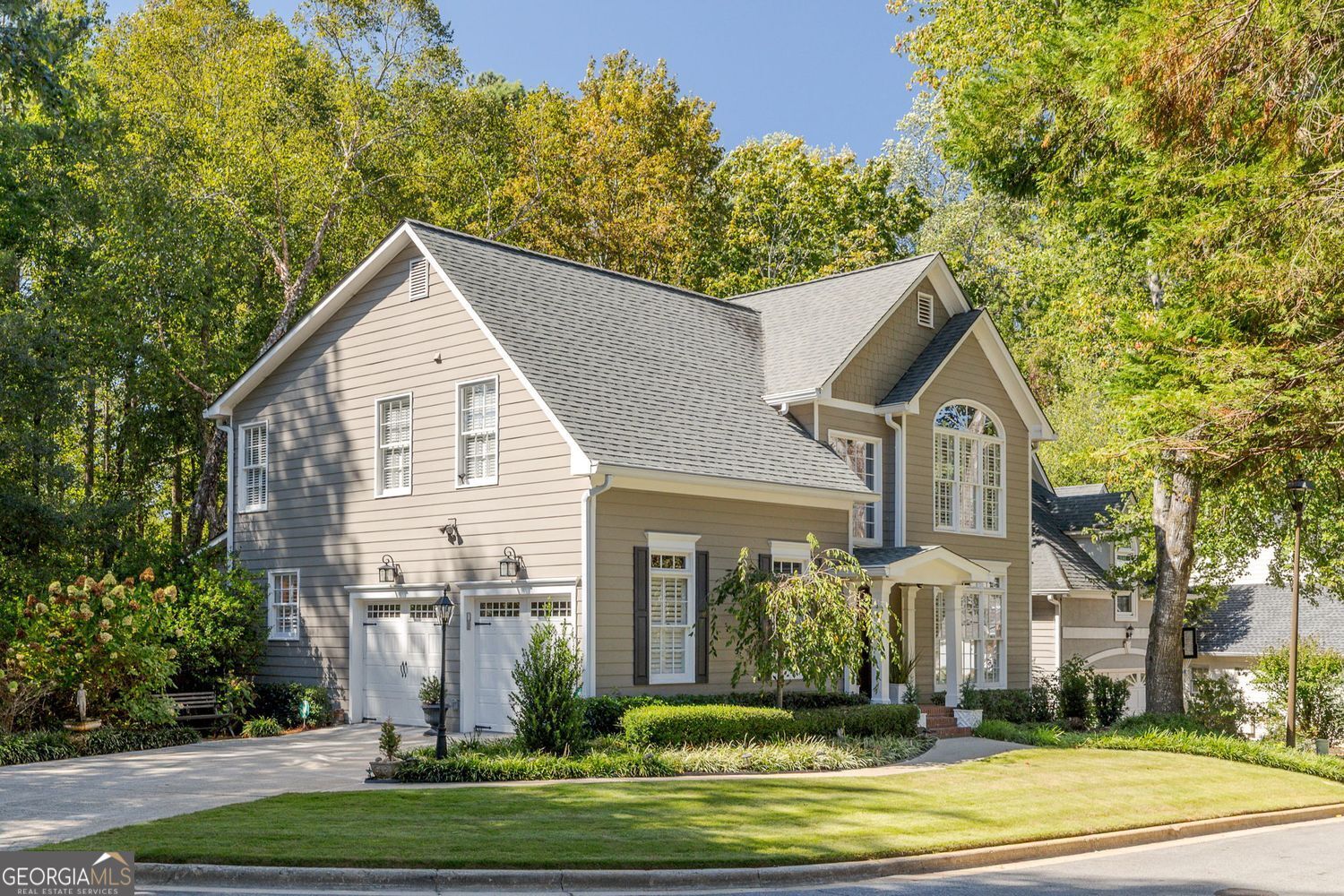A rare and exceptional opportunity in one of Brookhaven's most sought-after locations! This pristine 4 bedroom, 3.5 bath home with a full-finished terrace level and 2-car side-entry garage sits tucked away on a large and tranquil cul-de-sac lot. The home offers a large backyard and is surrounded by mature hardwood trees and a serene, wooded backdrop offering the perfect blend of privacy and appeal. The professionally landscaped front yard leads to a charming covered front porch. The stately front door welcomes you inside, where the two-story foyer and open-concept design features hardwood floors and custom plantation shutters throughout with an abundance of natural light creating an environment that is both spacious and inviting. The family room centers around a cozy gas fireplace. The separate dining room and French doors lead to a large deck which features a privacy wall and trellis overlooking the private backyard and expansive wooded area providing year-round privacy and natural beauty. The renovated kitchen has stainless steel appliances with gas range, microwave, 60/40 stainless steel sink, quartz countertops, under-cabinet lighting, breakfast bar, and casual dining area. The kitchen adjoins the sunroom/keeping room and overlooks the backyard and scenic natural backdrop. Both the kitchen and sunroom/keeping room open to a large deck, allowing for seamless indoor/outdoor lifestyle. The upstairs primary suite has a vaulted ceiling and adjoins the en suite bath with double vanities, whirlpool tub, frameless glass walk-in shower, and large California walk-in closet. The upper level also has two additional bedrooms with a full bath, plus a laundry center, linen closet, and bonus storage area. The expansive finished terrace level features a media/recreational/office area with a large storage closet and a fourth bedroom with an en suite bath. Also included downstairs is a flex/exercise/workshop room. Extensive updates ensure peace of mind for years to come: new Hardieplank siding on all sides, soffits, gutters, downspouts, windowsills, exterior lighting and receptacles, new front door, and French doors to the deck-plus so much more. The entire interior (walls and trim) and exterior trim have been recently painted. Newer HVAC systems (top and bottom) and 50-gallon water heater. Two-zone Rain Bird irrigation system. Perfect location - literally minutes from MARTA, Town Brookhaven, Costco, Publix, Kroger, medical facilities, Buckhead, public and private schools, and all major highway systems. This home provides the perfect blend of convenience, quality, and lifestyle. Truly a must-see!
