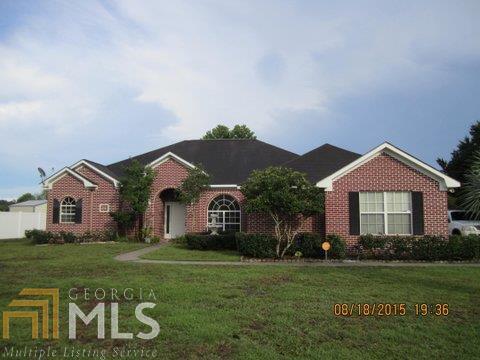 Have your cake and eat it too! This brick ranch has everything you need and more! Location plus 1/2 acre lakefront lot, lots of room to grow. Approx 2274 heated sq ft with many upgrades. 4 Bed, 2.5 BA, split plan, living room and large family room with fire place , hardwood floors throughout living areas, tiled floors in baths and kitchens, kitchen has a lot of work space, cabinets and island and breakfast bar.Upgraded appliances, master bath with whirlpool tub & separate shower, large walk-in closet. Up to date security system w/remote control, reverse osmosis water purifier.side entry two car garage .Walk distance to Kingsland Middle, Coastal College and High School. Short drive to I-95 Exit 3. A real value in the Lakes area.!