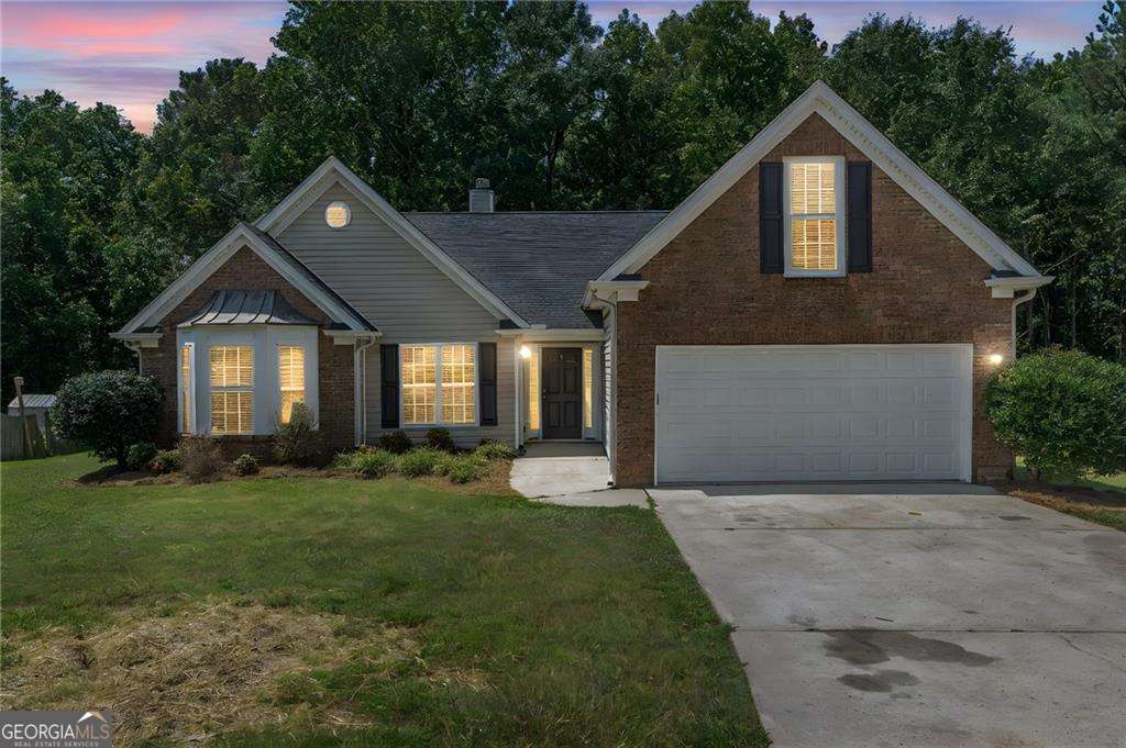 Perfect for first-time buyers! This brick-front ranch offers 3 bedrooms, 2 full bathrooms, and 2,164 sq ft of comfort and style. Fresh carpet and LVP flooring flow throughout, while the open dining and cozy living room with gas fireplace create the perfect gathering space. The spacious owner's suite features French doors leading to a spa-like bath with soaking tub, separate shower, dual sinks, and vanity. 2 large additional bedrooms and a versatile bonus room doubles as a 4th bedroom, office, or man cave. Step outside to a private patio and large backyard-ideal for entertaining. Tucked in a quiet community near Southlake Mall and Taste of Tara, this home blends convenience with charm. Move-in ready and waiting for you!