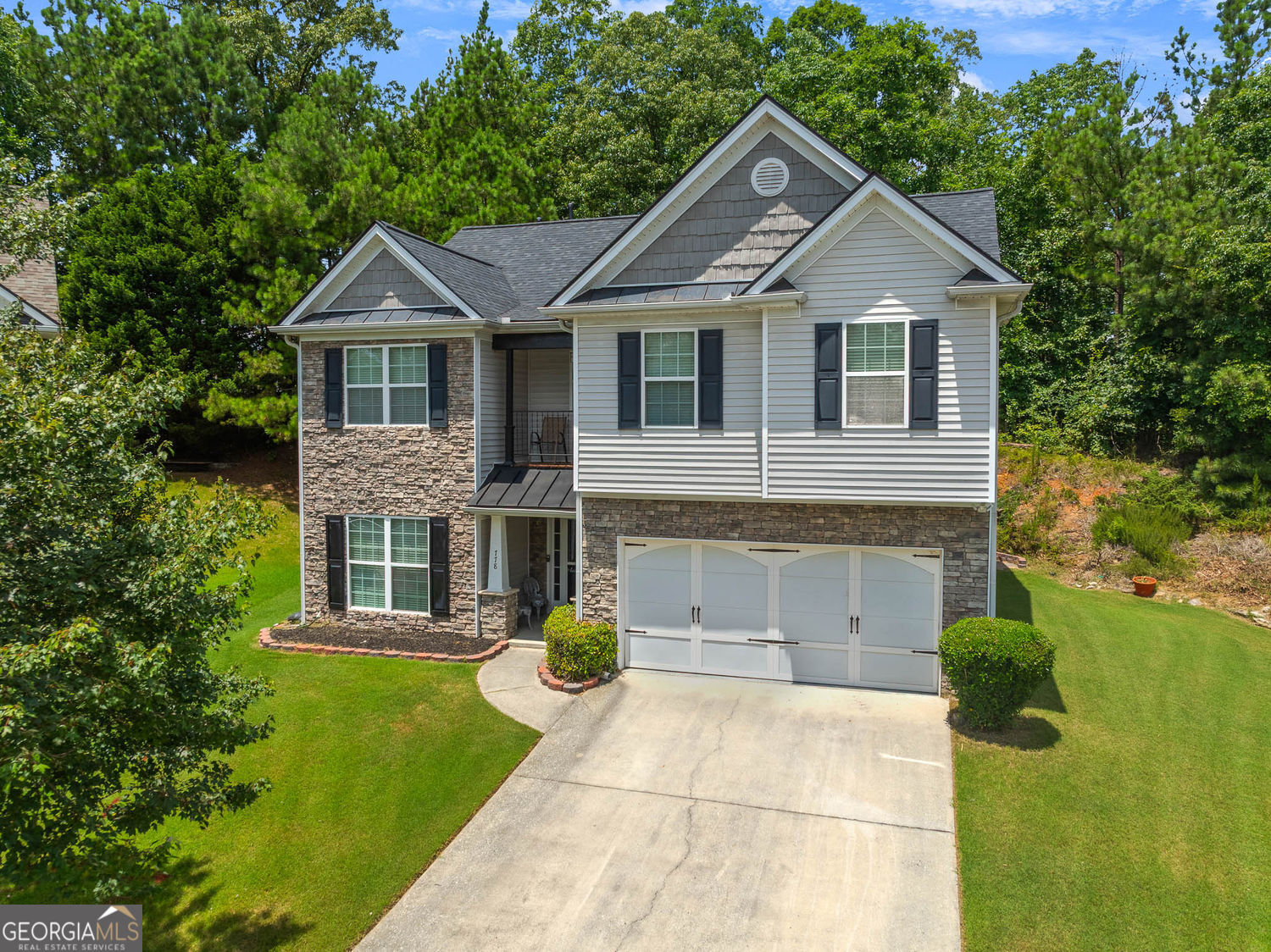Welcome to this beautifully updated 4-bedroom, 2.5-bathroom residence, perfectly blending classic charm with contemporary features. The stunning stone and siding exterior offers wonderful curb appeal. Step inside to discover engineered hardwood floors flowing seamlessly throughout, providing a cohesive and elegant feel. The interior is currently being freshly painted, ensuring a move-in ready experience! The spacious dining room boasts a unique wood accent wall, adding character and warmth - perfect for entertaining. Enjoy the added bonus of a gorgeous glass sunroom/year-round room, not included in the main square footage, offering a serene space for relaxation or an additional living area, bathed in natural light. This home offers incredible peace of mind with significant recent upgrades: the roof and HVAC system were both replaced in 2023, and a tankless water heater was installed in 2021 for endless hot water and energy efficiency. The expansive primary suite is a true retreat, featuring private access to a charming second-floor balcony - ideal for enjoying your morning coffee or unwinding in the evenings. Interior of home is being painted 7/28 - 7/30. Conveniently located just 7 minutes from the vibrant downtown shopping and restaurant scene in Sugar Hill, GA, you'll have easy access to local amenities, entertainment, and dining options. Don't miss the opportunity to make this meticulously maintained and thoughtfully updated home your own!