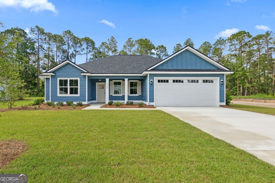 **Photos shown are of a similar home with comparable finishes and features; actual home under construction will vary in details and materials. Estimated completion of February 2026**  New home by local builder, Thrift Construction-this 4 bedroom, 2 bathroom home offers modern finishes and a functional split floor plan. The exterior features durable fiber cement siding and a 2-car garage with an included opener. Inside, the home boasts LVP flooring in the main living areas, carpet in the bedrooms and closets, and tile in both bathrooms. The primary suite includes a double vanity, standalone tub, and separate tile shower. The laundry room, located near the garage and primary suite, offers additional cabinet storage. The open-concept kitchen is equipped with GE Slate appliances, quartz countertops, and a large island that flows into the dining and living areas. Three additional bedrooms and a full bathroom are located on the opposite side of the home. Additional features include a tankless electric water heater and quartz countertops throughout. This thoughtfully designed home is move-in ready with quality finishes throughout.