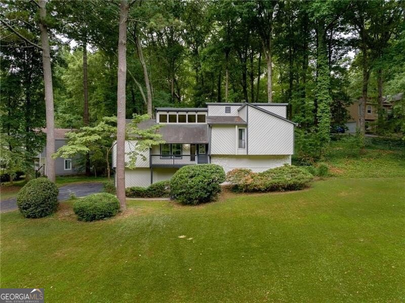 Discover your ideal home in the heart of the prestigious East Cobb Pope high school district! This spacious home has 4 bedrooms, 3 bathrooms and 2 garages, offering the perfect space for your family. Open concept, beautiful floors and fresh paint, new kitchen with stainless steel appliances and quartz countertops, new bathrooms with ceramic tile floors. Enjoy a prime location close to great schools and all the amenities you need, don't miss the opportunity to live in this amazing neighborhood!