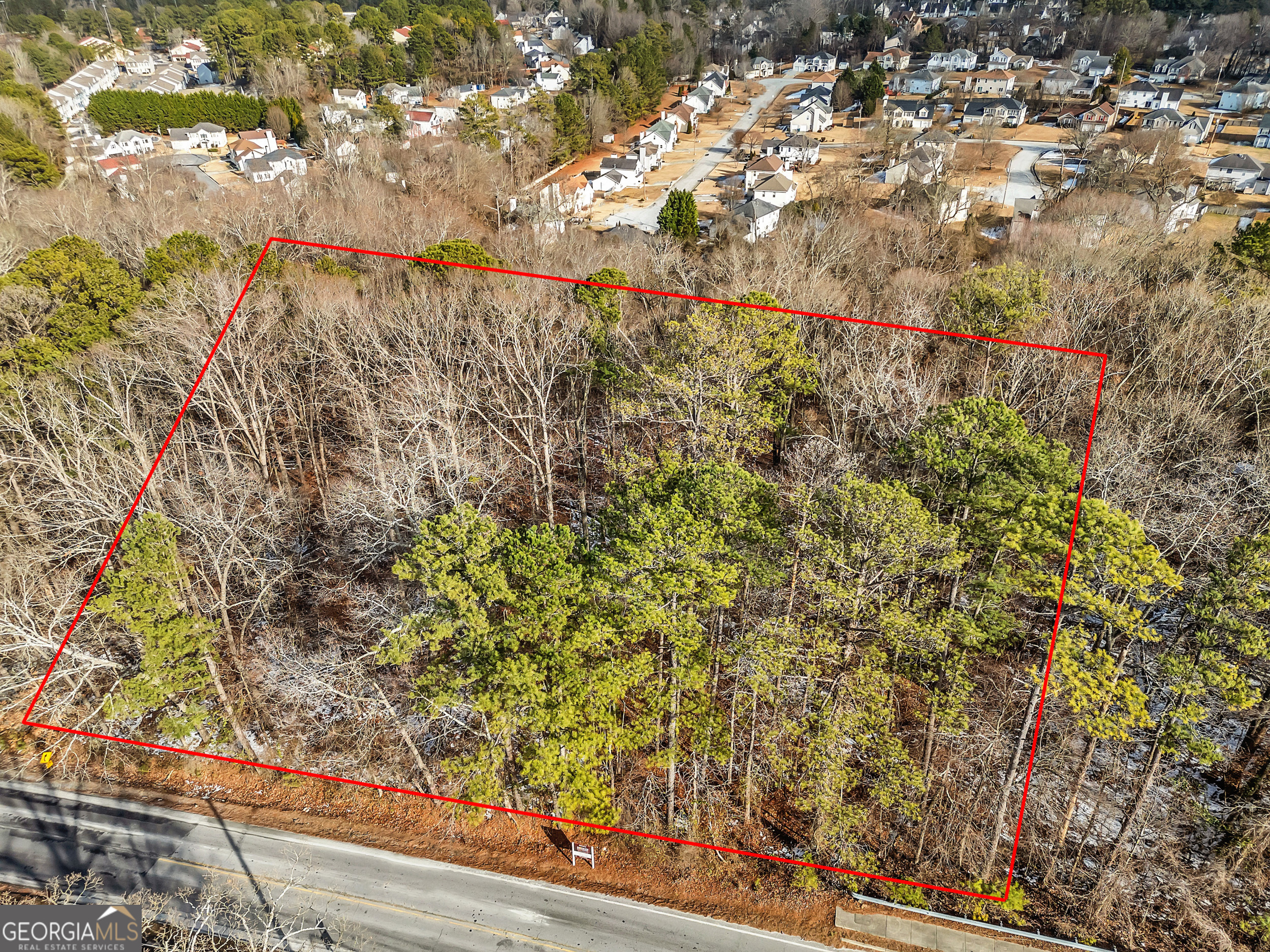 This prime 1-Acre commercial land parcel offers a fantastic opportunity for developers and investors. Zoned Local Commercial (C-1), this property features 210 feet of road frontage with primary utilities available at the site, making it a highly attractive location for a variety of approved commercial uses, including office, retail, recreation and residential development. Combined with adjacent parcels, this land presents a remarkable opportunity for creating a walkable, community-focused development that will contribute to the cultural fabric of Southest DeKalb. Whether envisioning a mixed-use retail center, an office building, or a residential community, this property is ideal for those looking to serve the local area with amenities that enhance both convenience and lifestyle. Developers are invited to explore the high potential of this site and create a project that supports the growth of the surrounding community. The parcel is situated in unincorporated DeKalb County, which provides flexibility for development, with easy access to major transporation routes and key community hubs. The land's slightly sloped topography, allowing for creative and efficient site design. It is strategically positioned near local schools, including being a short distance from Georgia State University Perimeter College, attracting a steady stream of students, faculty and staff. The property is also adjacent to MARTA transit stop, offering convenient public transit options, and is just a short drive from interstate highways, enhancing accessibility and visibility. Developers are invited to explore the high potential of this site and create a project that benefits the local economy, enhances the surrounding community and meets the area's growing demand for convenient, pedestrian-friendly spaces. Don't miss the chance to bring your vision to life at this highly accessible and well-positioned location.
