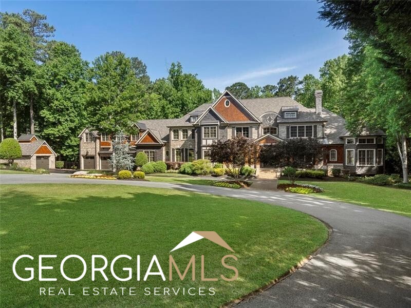 Welcome to this one-of-a-kind private gated estate at the foothills of historic Lost Mountain in Marietta! This breathtaking 4-sided brick home sits on perfectly manicured 5.58 acres including a guest house, 5 car garage, Gunite Pool/Hot Tub and Sport Court. Enter custom double doors to the grand foyer with 20+ foot ceilings. Main level offers an incredible kitchen with double Wolf ovens, Sub-Zero refrigerator and ice maker. Kitchen opens to Family Room complete with Custom Bookcases, Vaulted Ceilings with Beams and Fireplace looking out to stunning views of the backyard oasis. Spacious Primary Bedroom on main with sitting area and double-sided fireplace leading to ensuite bathroom with large walk-in dual closets. 3 additional bedrooms on main with ensuite bathrooms and walk-in closets. Main floor also features 2 offices, one with a fireplace, built-in bookcases and coffered ceilings. Upstairs features in-law or Au-pair Suite with living room, full kitchen, and laundry room as well as 3 guest bedrooms with full bathrooms. Large walk-in attic with built-in storage. Basement has it all including full bedroom and bath, 2 game rooms, gym, sauna, and custom bar with cabinets, ice makers, and multiple fridges. The walk-in wine cellar and movie room complete this amazing space. Additional rooms in basement include a Sunroom and seating area with Fireplace. Backyard paradise designed for entertaining includes gorgeous pool with pool house, outdoor kitchen, Sport Court, In-ground Trampoline, lush greenery and tons of space for gatherings. This spacious, custom-built property has everything you're looking for in Marietta or Cobb County with great schools and location! Close to Shopping and Restaurants. Excellent Private or Public Schools.