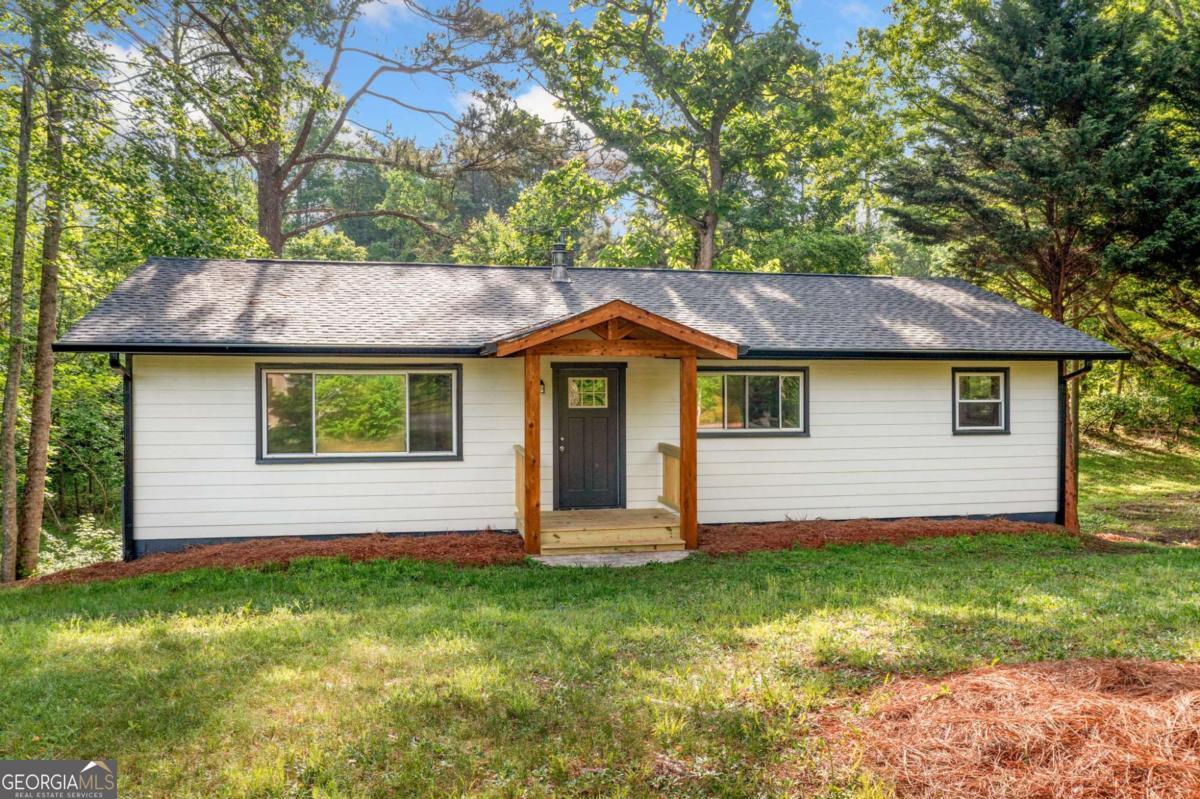 Welcome to 474 Upper Burris Rd - a beautifully updated gem that blends modern upgrades with classic charm. Featuring new siding, a new roof, and a new HVAC system, this property offers peace of mind for years to come. Step inside to discover a rustic living room with a charming (and user-friendly) stove, leading to an inviting and spacious kitchen with lush panoramic outdoor views! The layout is perfect for everyday living or entertaining. Set on a generous private lot, you'll have plenty of room for outdoor work and play!