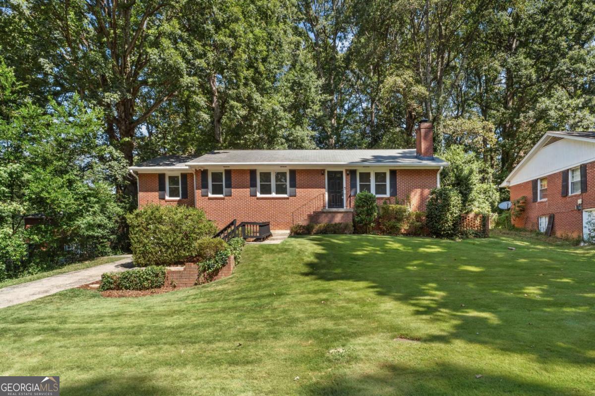 Welcome to this classic 4-bedroom, 2-bath brick ranch built in 1957, brimming with character and timeless details. Step inside to find solid hardwood floors flowing throughout and beautifully preserved original tiled bathrooms that showcase mid-century charm. The spacious layout includes a full basement, offering endless possibilities for recreation, hobbies, or additional storage. A one-car garage provides both convenience and functionality. Perfectly located near the vibrant Smyrna Market Village, this home places you minutes away from local dining, shopping, and community events, all while enjoying the comfort of a quiet residential neighborhood.