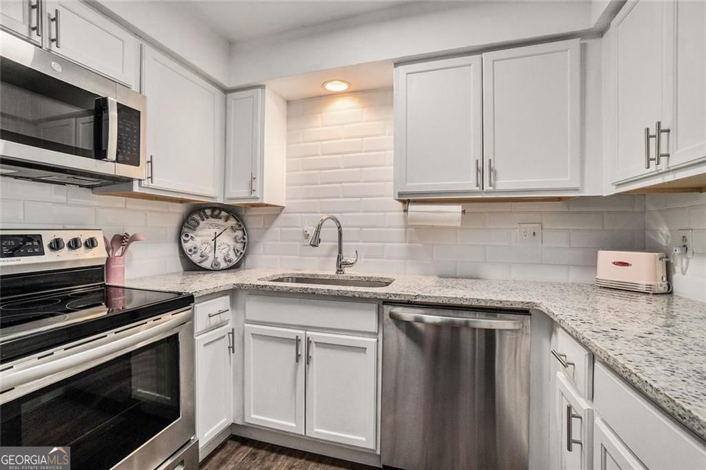 Photo of 94 Rosaire Place NW, Atlanta, GA 30327 (MLS # 10676326)