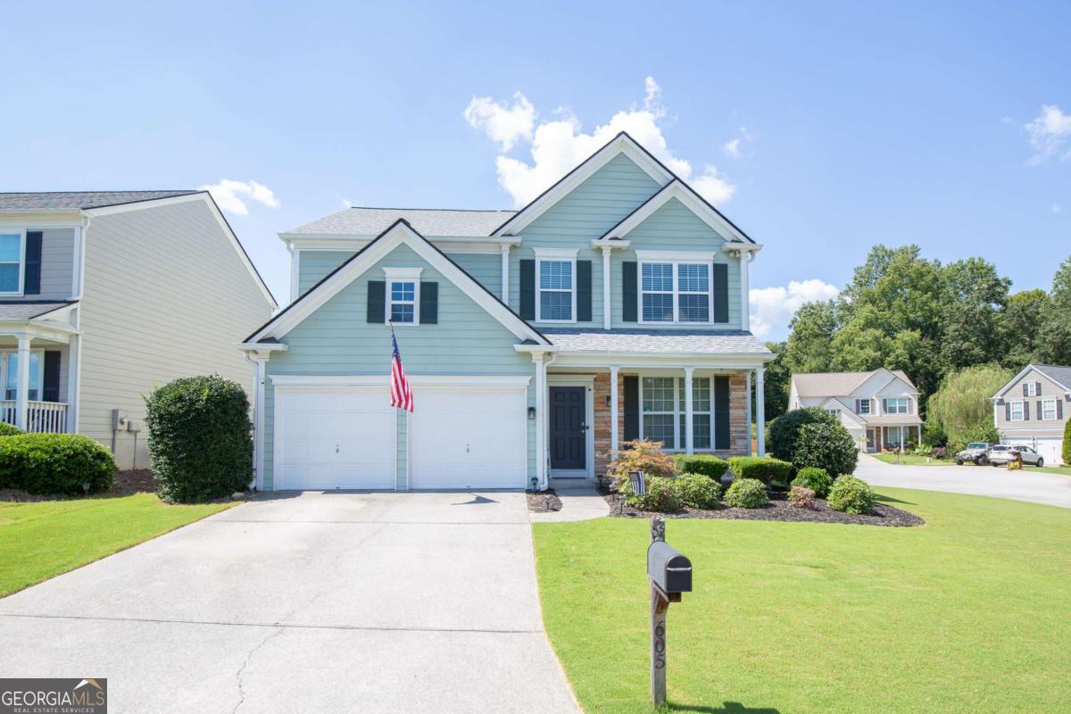 Welcome to the sought after community of Woodlands neighborhood! Close to everything Woodstock has to offer, including just minutes from the growing downtown area. This 3 bedroom, 2.5 bath home has been updated from top to bottom! Features include smooth ceilings, updated light fixtures, NO carpet, updated kitchen and bathrooms, newer roof, newer hot water tank, two story living room, open concept main areas, cozy fireplace, and great primary bedroom walk-in closet with built-ins. The updated kitchen and bathrooms offer white cabinets with quartz counters and stainless fixtures. The primary bathroom has been meticulously updated with a beautiful soaking tub and marble throughout. The eat-in kitchen features a new sliding door that opens to a private, fenced, backyard, perfect for outdoor meals and fun! The second floor laundry room has been updated with tile and cabinets. Other features/updates include: split HVAC system (two thermostats), Honeywell smart thermostats, updated exterior fixtures, smart doorbell, updated HVAC system, updated LG kitchen appliances, new chimney cap, and spacious corner lot. The neighborhood amenities include a large pool (with kids pool and waterslide), secondary pool, large clubhouse, basketball courts, tennis courts, beach volleyball court, an extensive playground, walking trails, pickleball courts, and access to the newest Woodstock public park (back of the neighborhood). Convenient to I-575 (approximately 5 miles) with access to the express lanes. This home is completely move in ready and a must see! Welcome home!