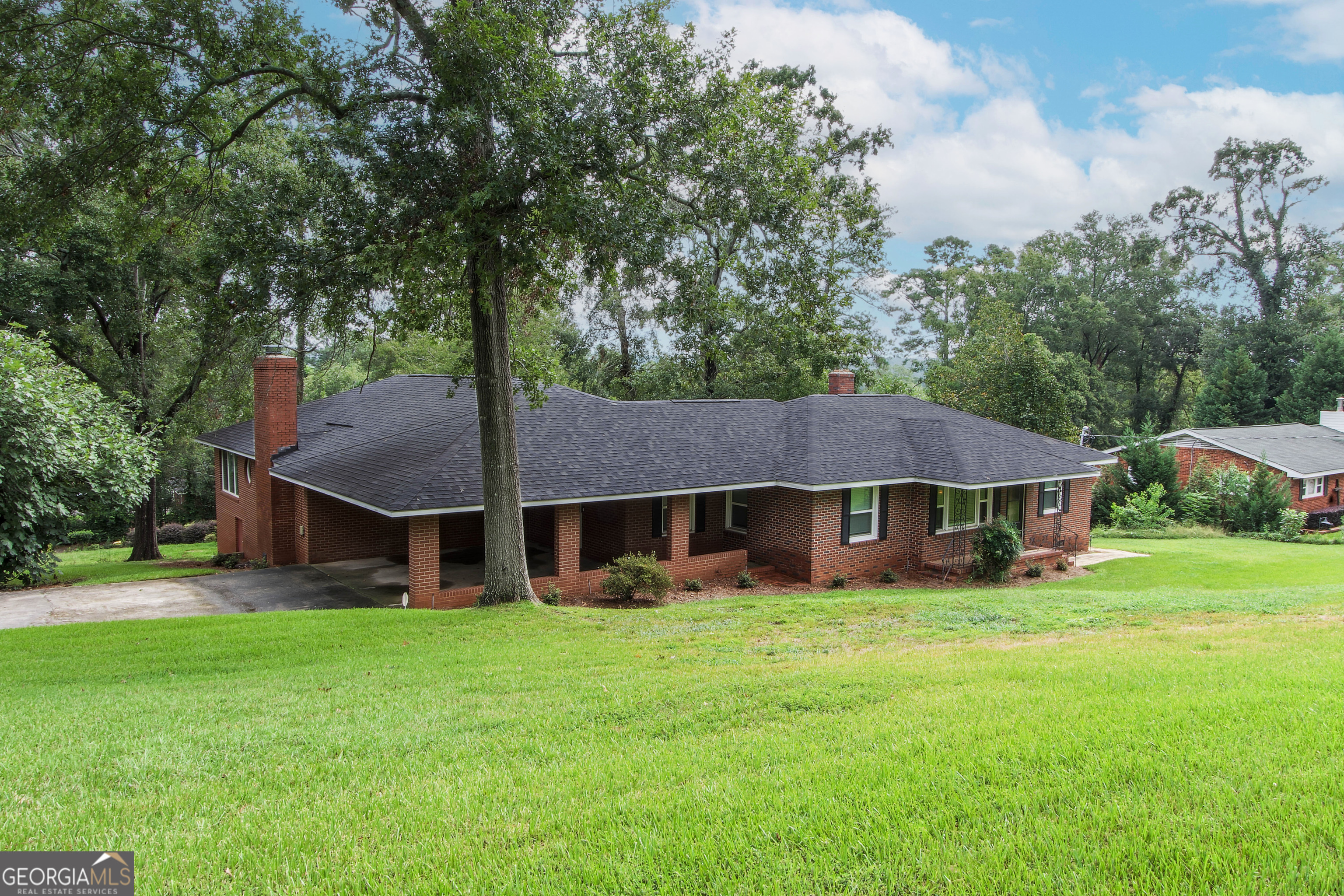 Exceptional opportunity in the desirable Fruitland Estates neighborhood-just minutes from Augusta National Golf Course. This meticulously maintained 5-bedroom, 3-bath residence offers approximately 2,755 sq. ft. of thoughtfully designed living space, ideal for both full-time residence and investment potential during Masters Week and throughout the year. Easy access to the beautiful Augusta canal walking trails and Olmstead Park. Recent upgrades include a New HVAC system in 2024, New Windows 2020, New roof in 2019, and New granite countertops and back splash providing comfort and peace of mind. The Spacious Kitchen has plenty of cabinets and countertop space including stainless appliances. Gorgeous primary bedroom with brick fireplace that opens to a large, tiled sunroom. The home's expansive floor plan features multiple entertaining spaces, including a spacious family room, a heated sunroom, and direct access to a 12' x 21' new rear deck great for grilling and entertaining. A 16' x 35' enclosed storage building/workshop offers exceptional utility for hobbies or additional storage needs. Conveniently located near premier shopping, dining, and recreation, this property presents a rare combination of location, condition, and versatility.