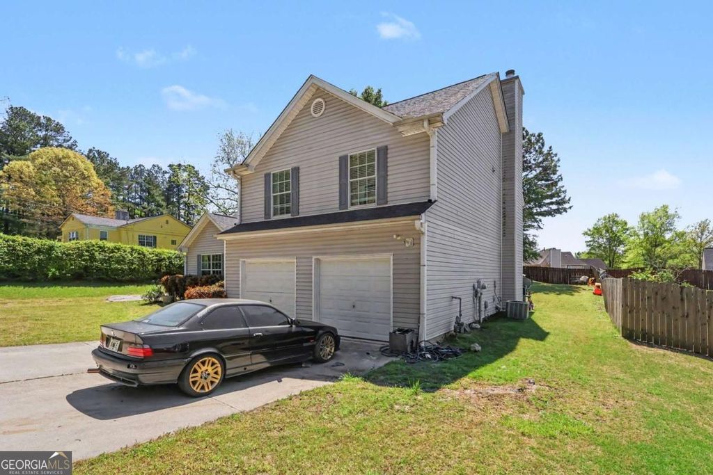 Photo of 7627 Pleasant Hill Road, Lithonia, GA 30058 (MLS # 10731629)