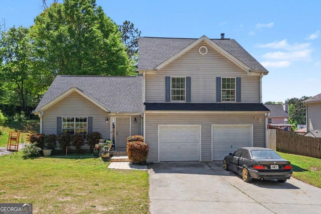 Photo of 7627 Pleasant Hill Road, Lithonia, GA 30058 (MLS # 10731629)
