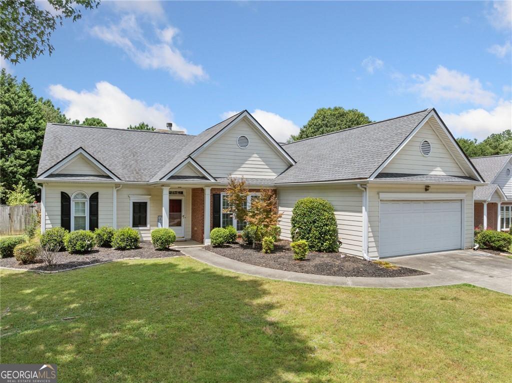 WELCOME HOME! You're going to love this stepless, beautifully maintained ranch home offering the perfect blend of comfort, style, and function, all on a single level. The true gem of this home is the private owner's suite, thoughtfully positioned on its own side of the house for maximum privacy. French doors open to a spa-like ensuite bathroom with dual vanities, a tucked-away toilet, beautiful beechwood LVP flooring, and a generous walk-in closet which features a window and plenty of natural light. Leaving the owner's suite, you are met with the beautiful open concept layout. The formal dining room makes an elegant statement with luxurious feature walls, while the spacious living room boasts soaring cathedral ceilings and a cozy fireplace as its centerpiece. The upgraded kitchen features gleaming marble countertops, a beautiful new sink, and an adjacent eat-in dining area, perfect for casual meals. A bright flex space off the main living area offers endless possibilities-currently set up as a game room complete with a foosball table, this space could also serve as a sunroom, office, indoor garden oasis, playroom, or craft area to fit your lifestyle. One of the best features of this home? NO CARPET-just low-maintenance, high-style flooring in every room. This adds a luxurious feel to the 2 secondary bedrooms which both have access to a well-maintained secondary bathroom which is located in the perfect location for guests to also use. The outside of this beautiful home is just as upgraded. Step outside onto your covered back porch and fall in love with your fully fenced, level backyard, ideal for pets, play, or peaceful afternoons outdoors. Looking for even more reasons to love this house? The roof is only 5 years old, and the current owner has maintained a service contract with Hawk Pest Control to keep the home bug free. This truly is the PERFECT home for anyone seeking stylish, low-maintenance one-level living in a fantastic location. Only 5 minutes from Kroger, 10 minutes from downtown Lawrenceville and Duluth, this home perfectly balances quiet community with quick access to shopping, delicious dining, and entertainment. Run, don't walk, to schedule your showing today!