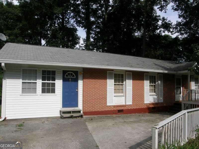 RARE FIND in Smyrna! This solid BRICK FRAME features 4 Bedrooms/2 Baths, sits on a HUGE, LEVEL CORNER LOT--- one of the largest in the neighborhood! Fresh on the market and full of potential. It has original hardwood floors throughout, a white kitchen and usable large tall, walk-in Crawl Space/Basement currently used as storage. It's perfect for those looking to add value through renovation or TLC. Located in the Campbell HS District, this quiet and established neighborhood is just minutes from the Battery, shopping, Cumberland Mall, restaurants, and I-285/I-75. INVESTORS TAKE NOTE this home will make a good rental opportunity, offering a strong return with minimal updates. It is in PRIME LOCATION, BIG LOT, SOLID STRUCTURE. Great for first-time homebuyers, flippers or rental investors. Call or Text me today and make this home your own!