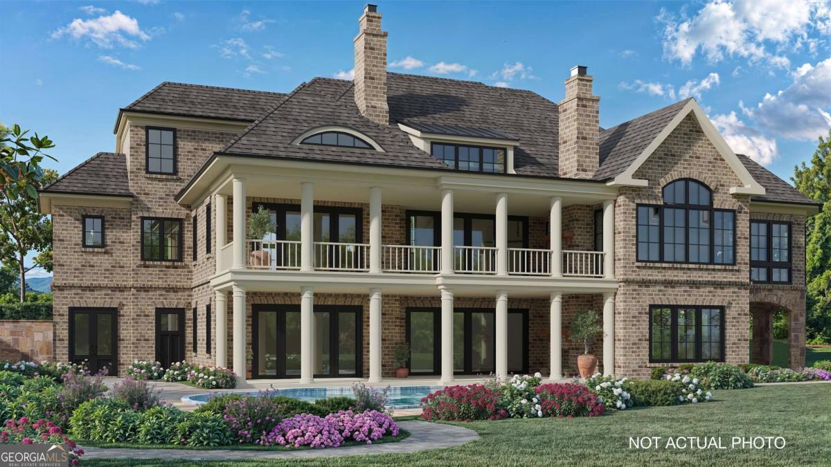 Another enviable custom golf estate built by Walden Signature Homes offering 5 bedrooms, 6.5 bathrooms, and just under 8,400 sqft with sweeping vistas overlooking the 12th green at Reynolds-Oconee Course. Meticulously built with all brick, stone and Hardie Shake - estimated completion is early Spring 2025. This enclave presents an open concept layout, graced with hardwood floors, 3 isokern masonry style fireplaces, custom cabinets, 2 screened porches with fireplaces, high vaulted beam ceilings, deluxe landscaping, elevator, heated/cooled garage, and a grandeur of elegant trim throughout. A fully appointed Chef's kitchen with side by side Sub Zero 36" Refrigerator and 36" Freezer, Wolf 48'' Chefs Range, quartzite counters, beverage fridge, ice machine and butlers pantry. Luxury living at its finest with a home theater, game room, wine cellar and bar, heated salt water pool and spa with sweeping vistas of the golf course, and space that will be finished as either a gym or golf simulator room. Walking distance to Reynolds Lake Club, Marina and The Ritz-Carlton. Golf Membership will be made available.* Details subject to change during construction.